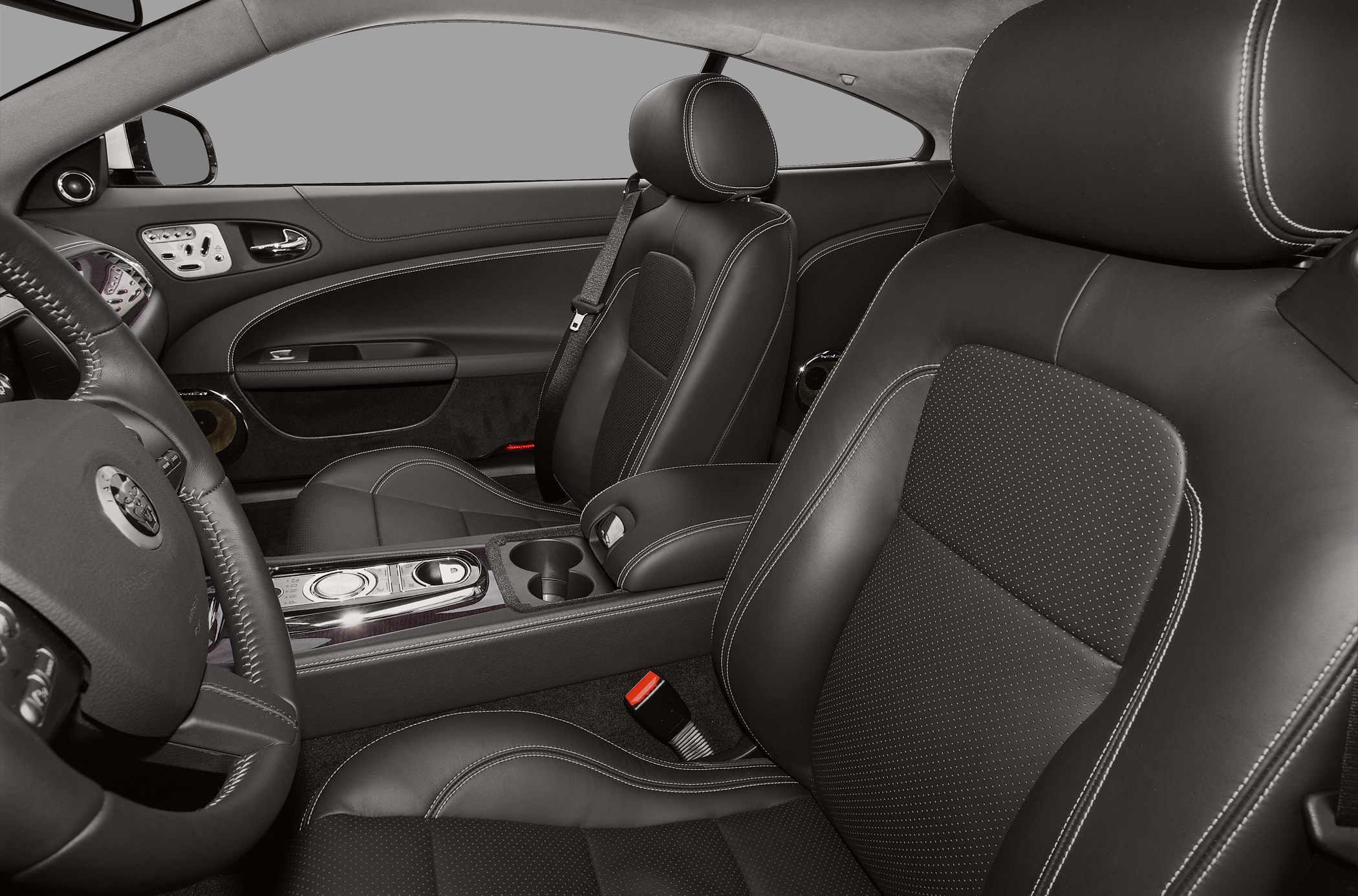 Luxury leather seats with detailed stitching and central control panel