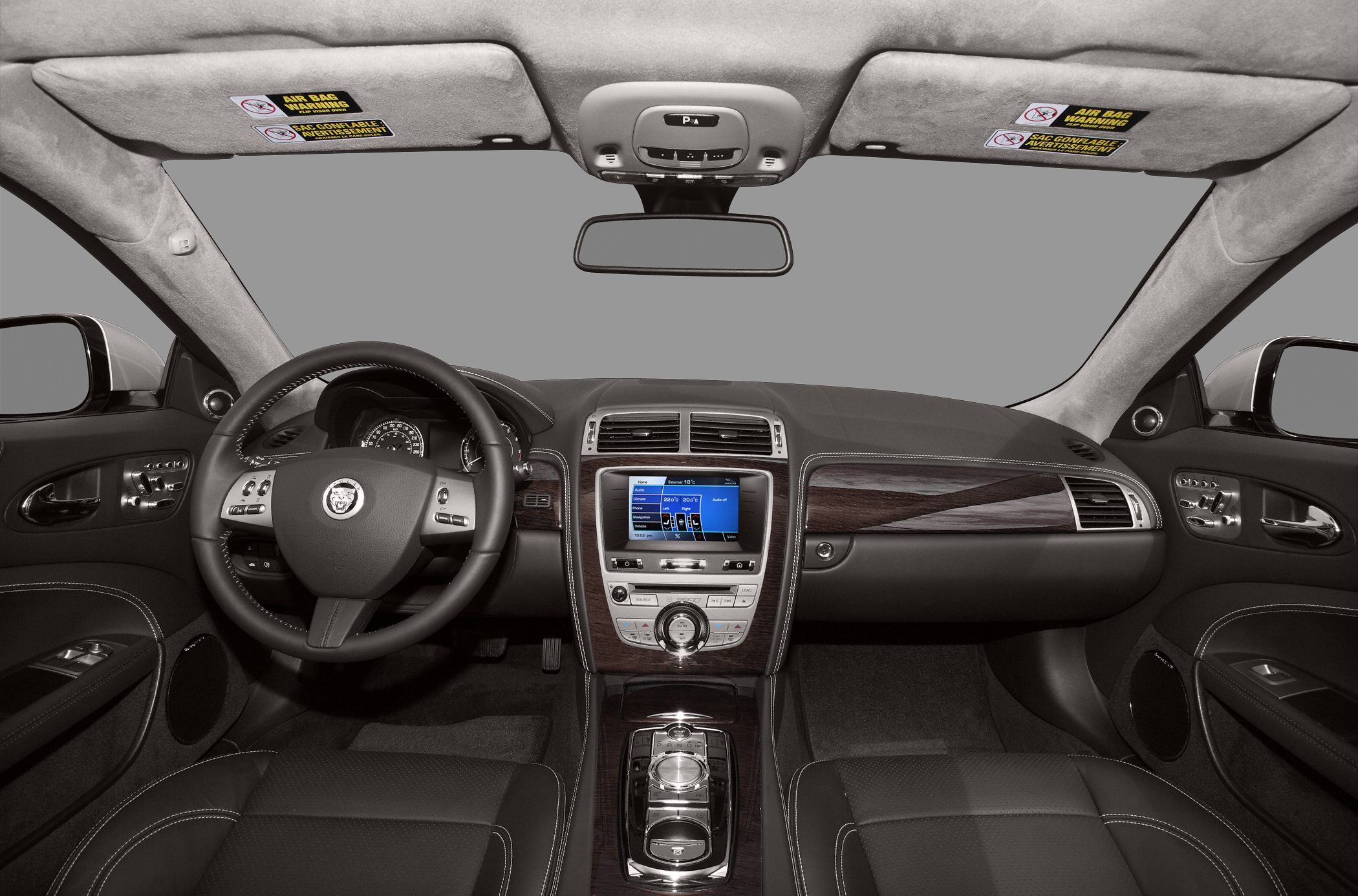 Luxury dashboard with wooden trim and multifunction steering wheel