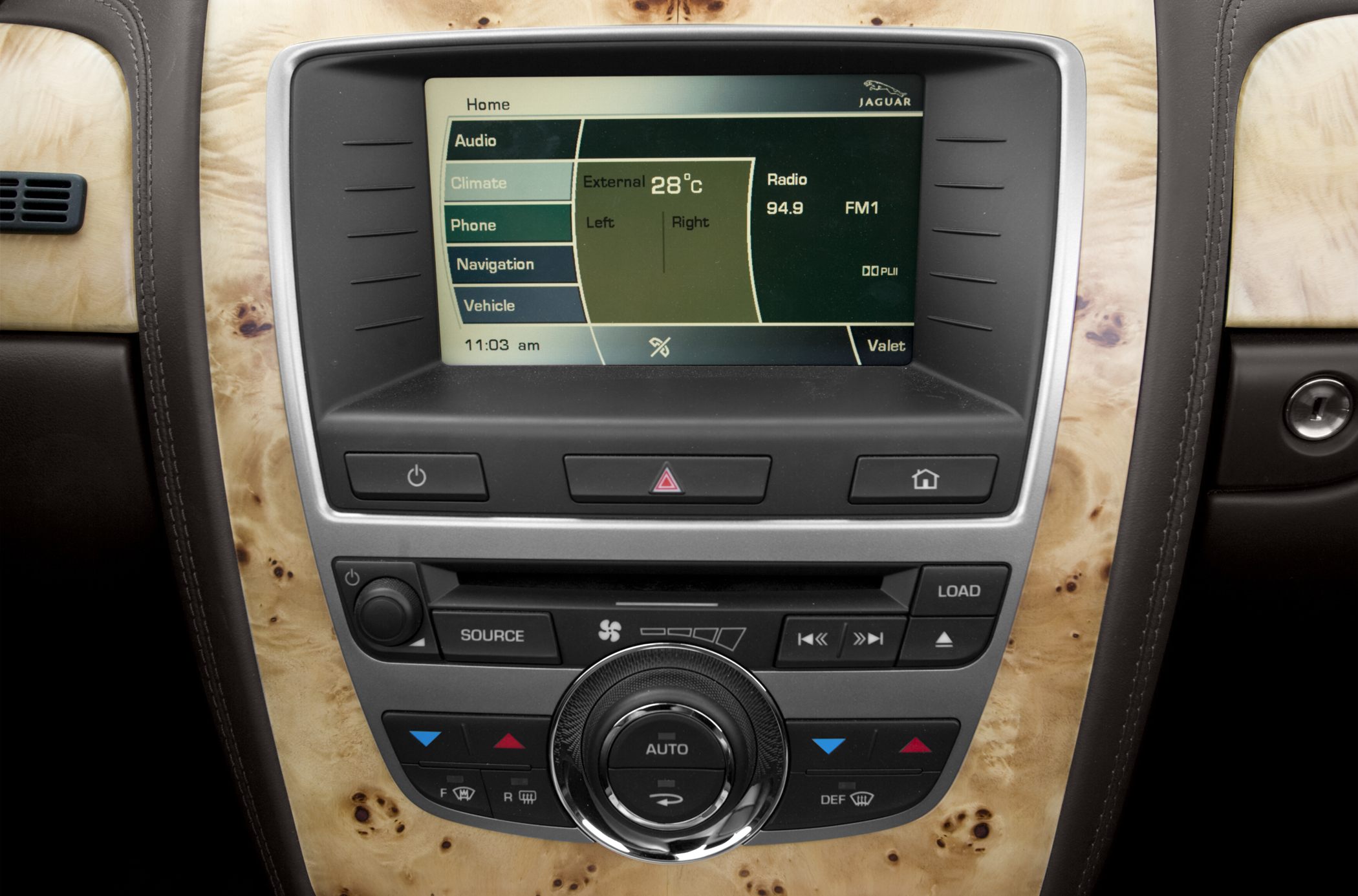 Infotainment screen and automatic climate control panel with wood trim
