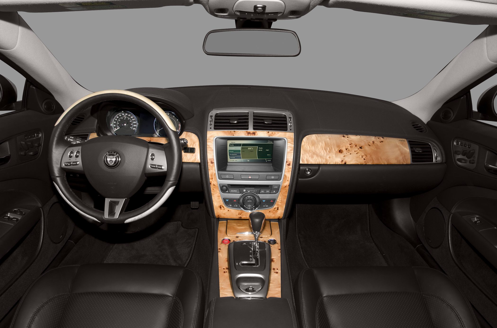 Luxury car interior with wood trim and modern dashboard design