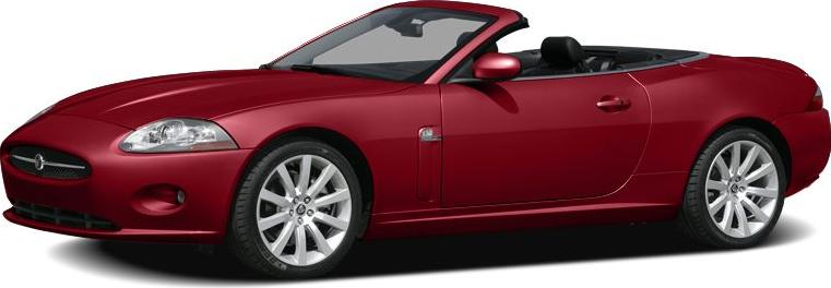 Sleek red convertible sports car with open roof and modern aerodynamic design.