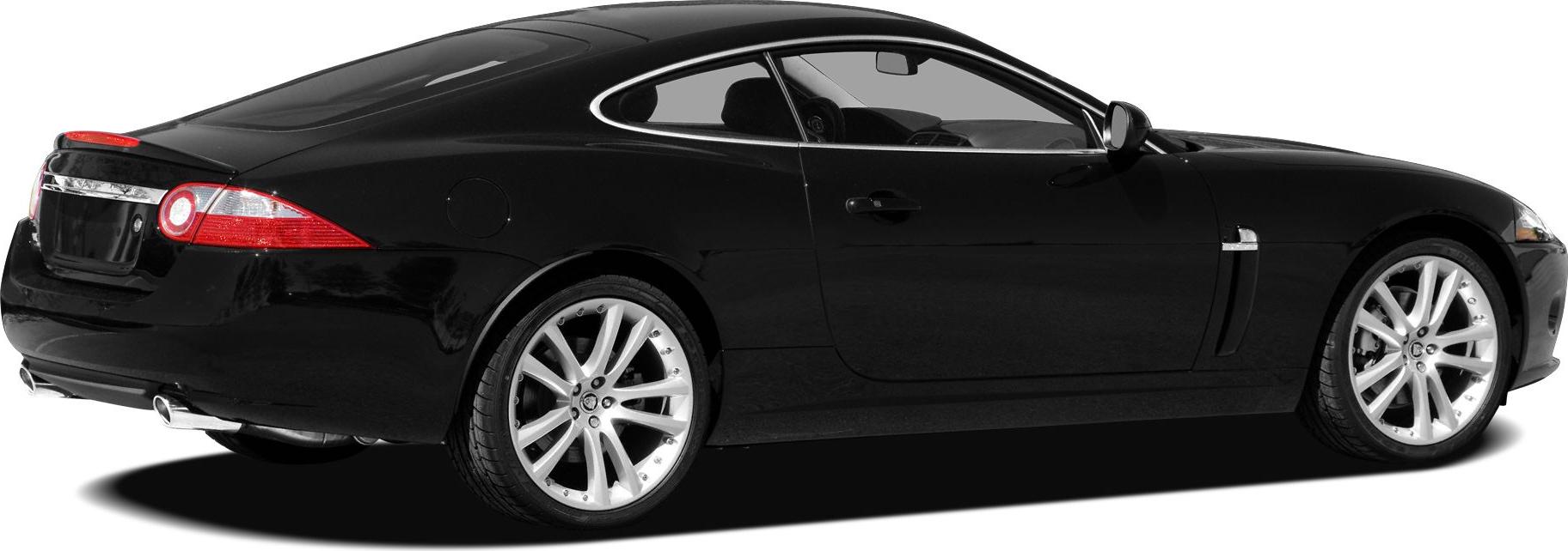 Black luxury coupe rear side view with alloy wheels and dual exhausts
