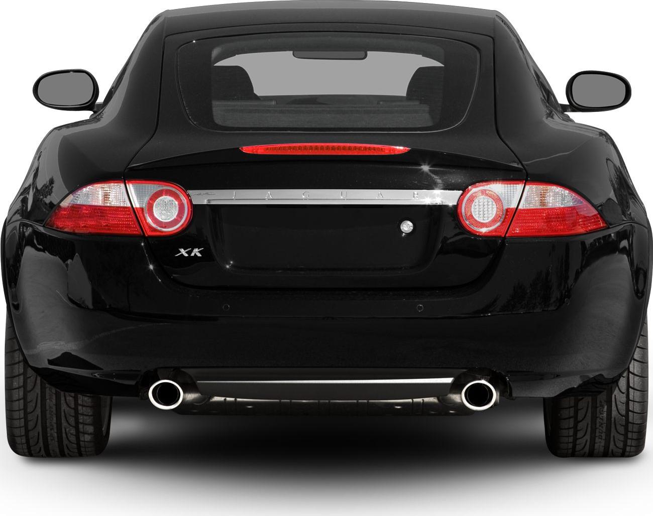 Rear view with circular tail lights and dual exhaust pipes.