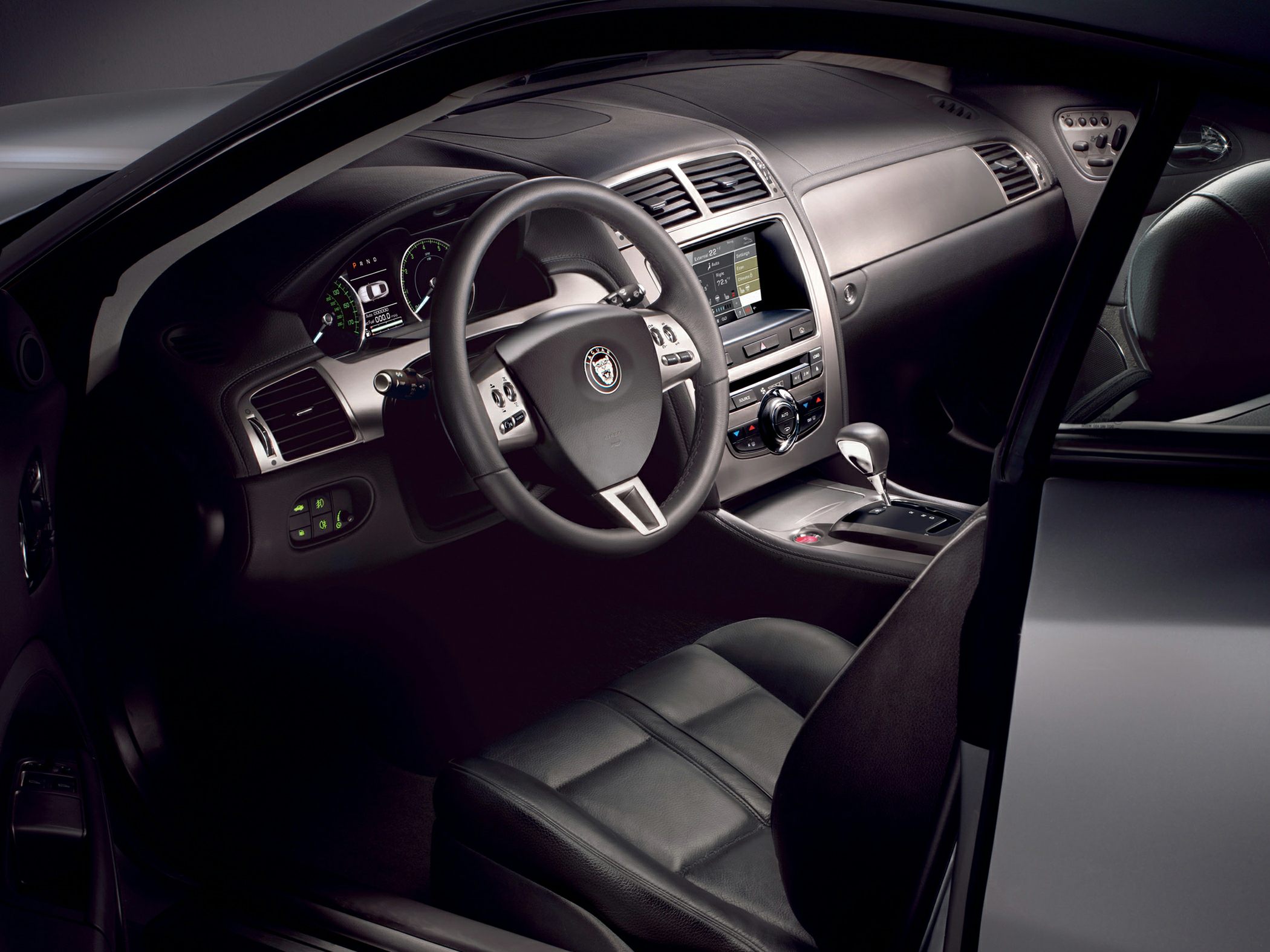 Dashboard with steering wheel and infotainment system in luxury sports coupe