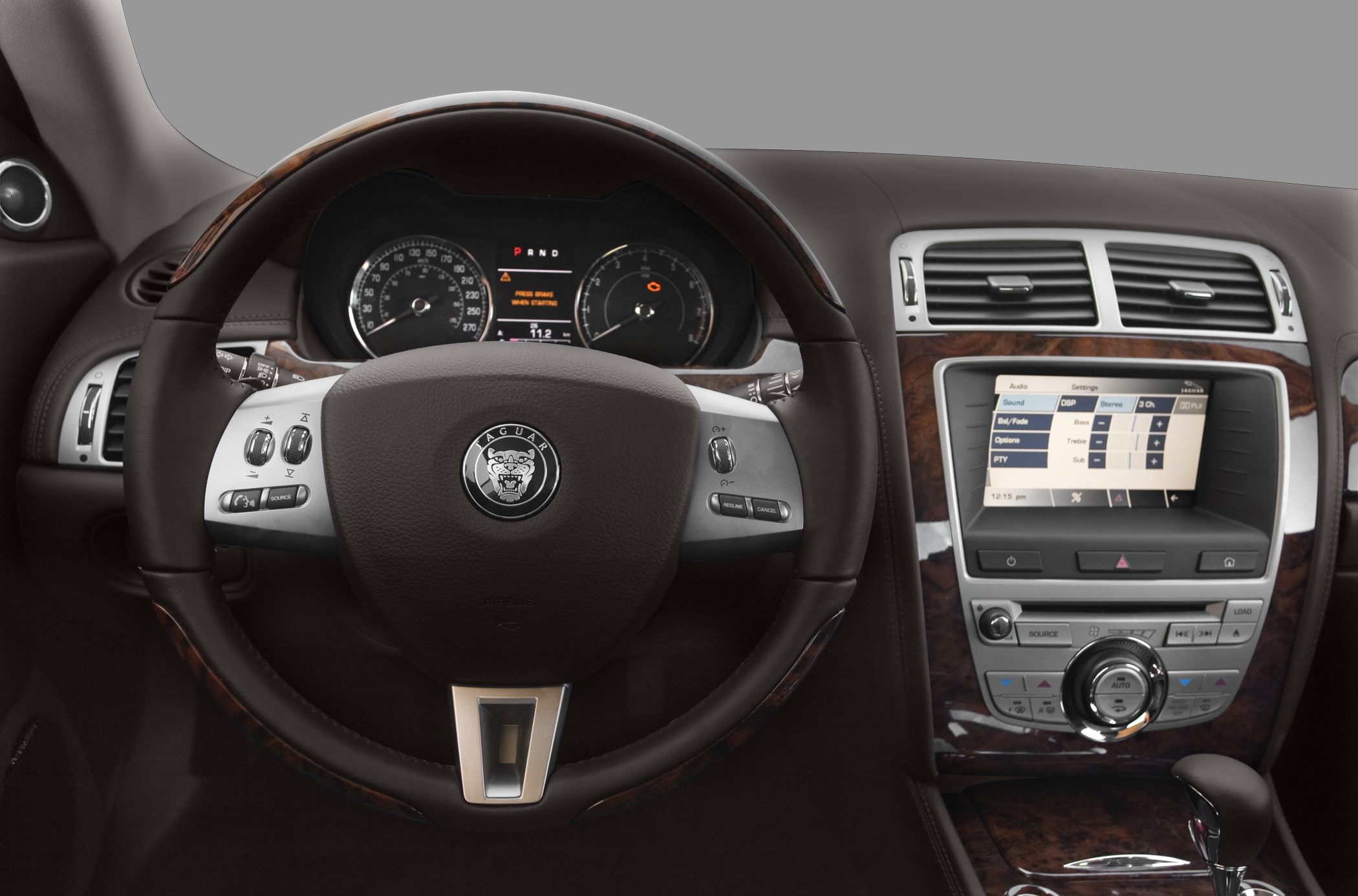 Luxury car steering wheel, instrument cluster, and infotainment system interior