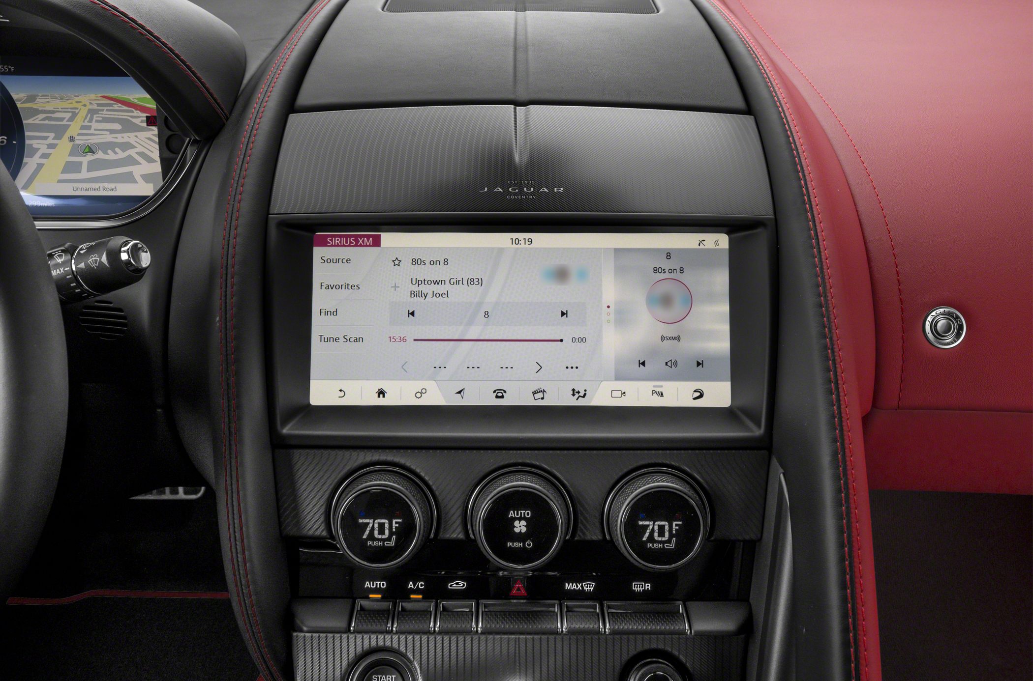 Central touchscreen interface with climate control dials and red leather trim