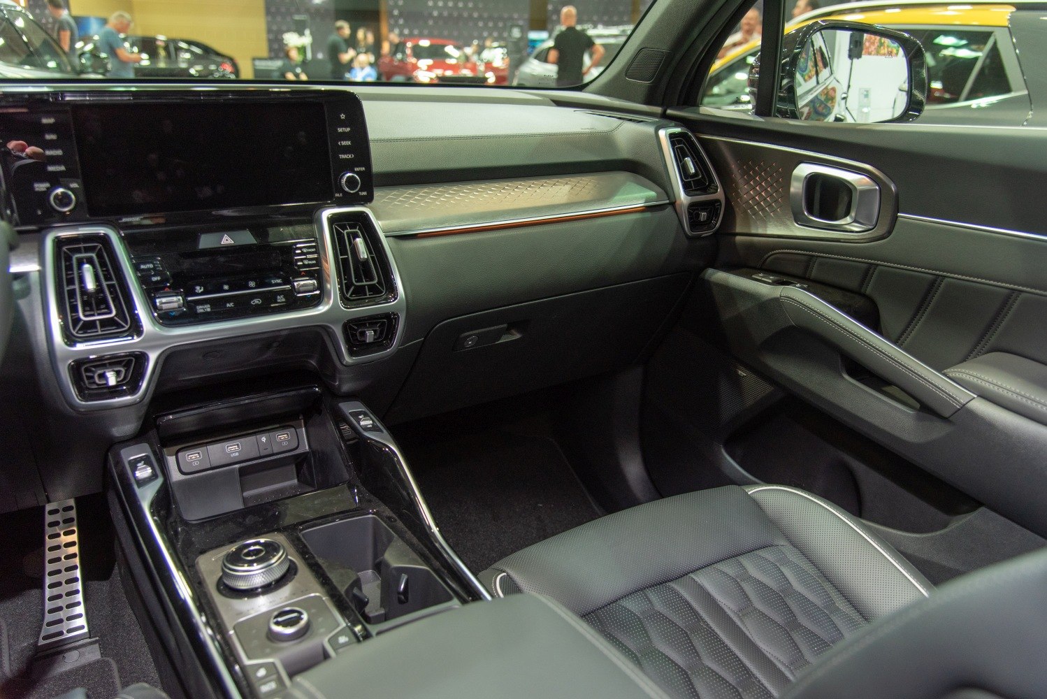 Dashboard, touchscreen display, center console, leather seats, and door interior