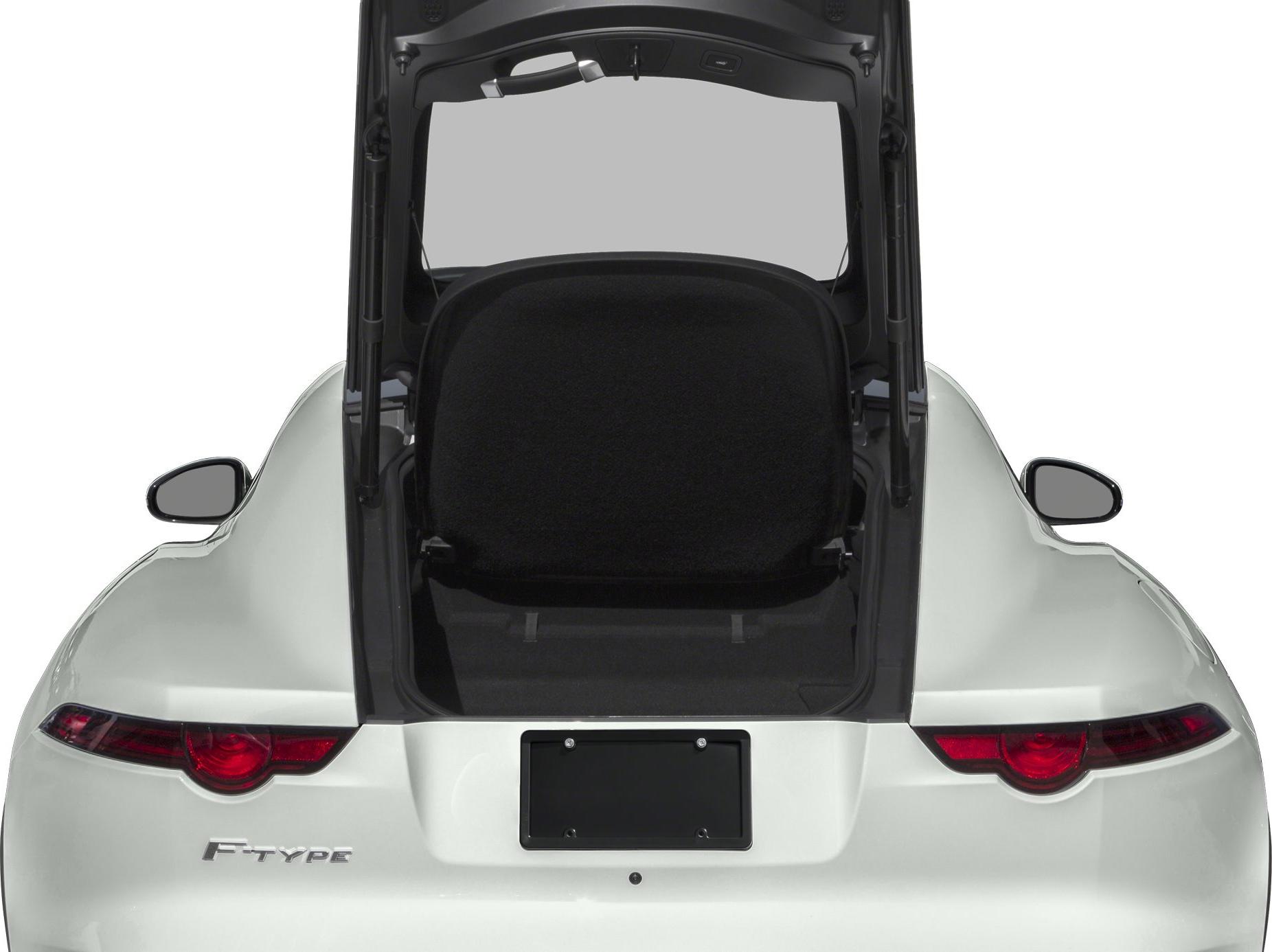 Rear view of open trunk and taillights on white sports coupe