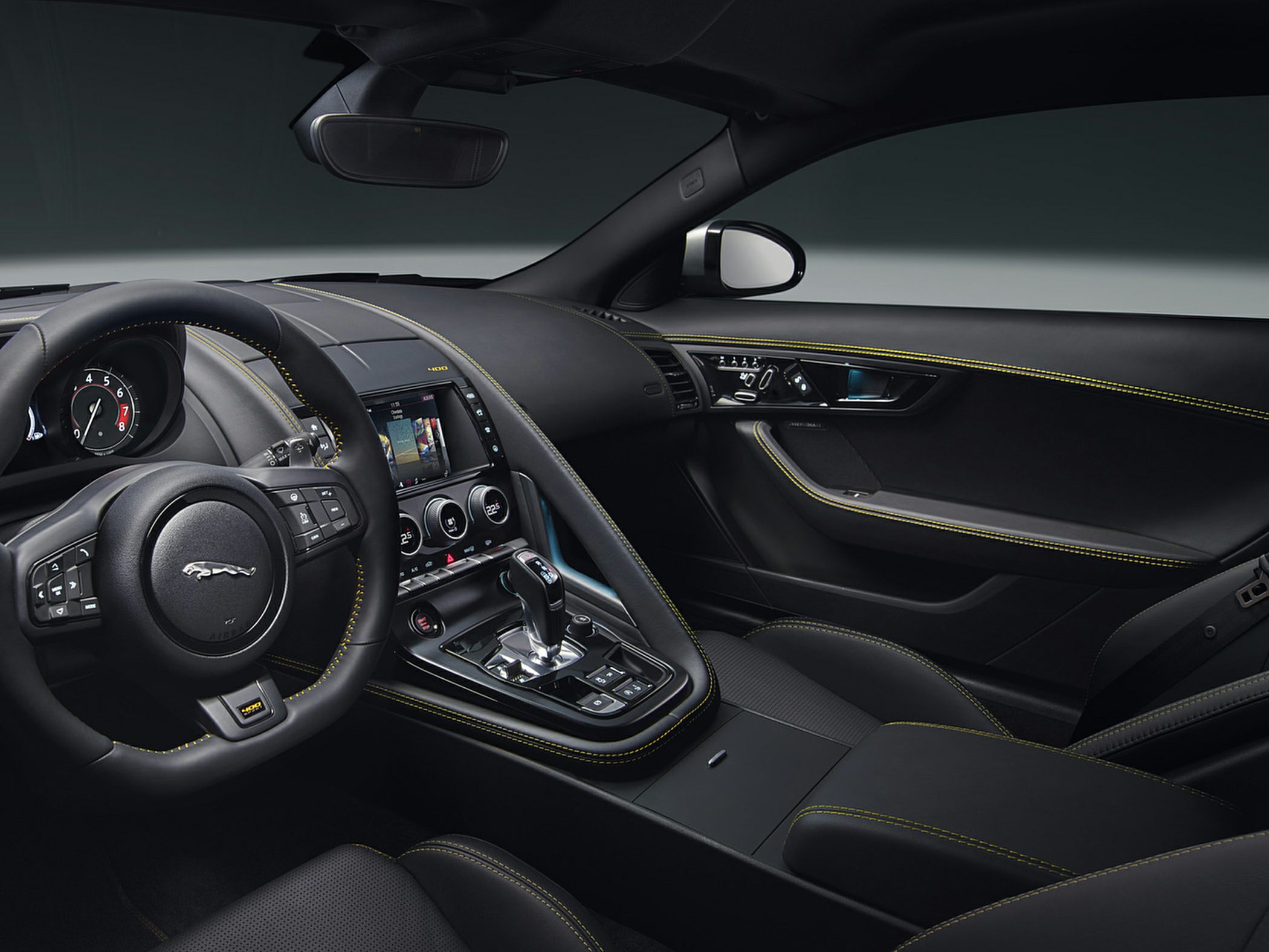 Luxury sports car interior with leather and yellow stitching
