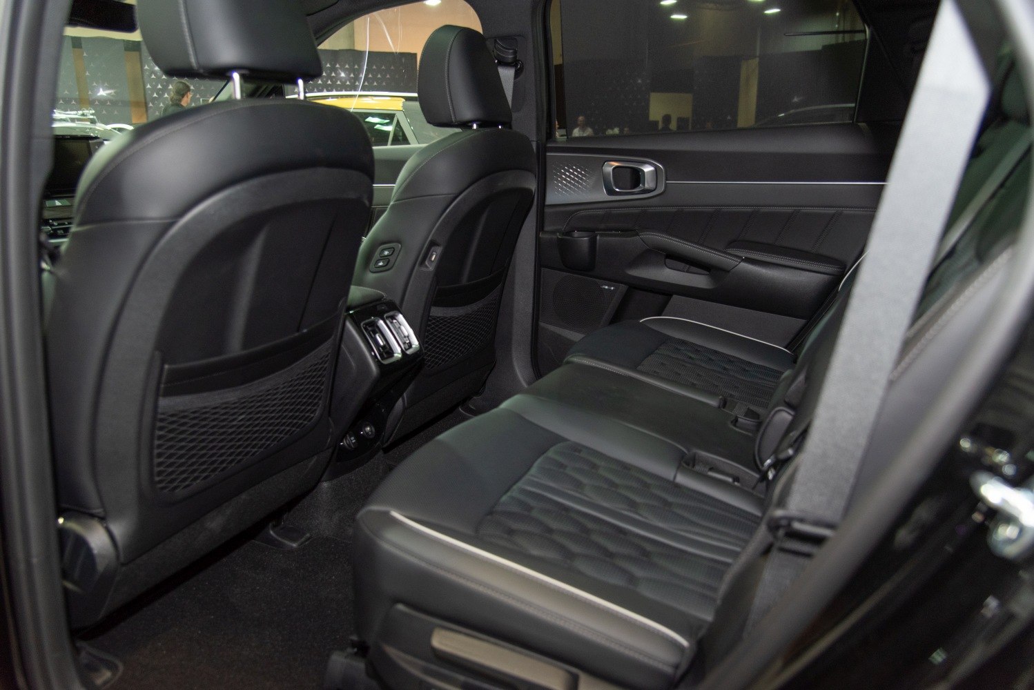 Leather rear seats and modern rear interior with air vents and door panel