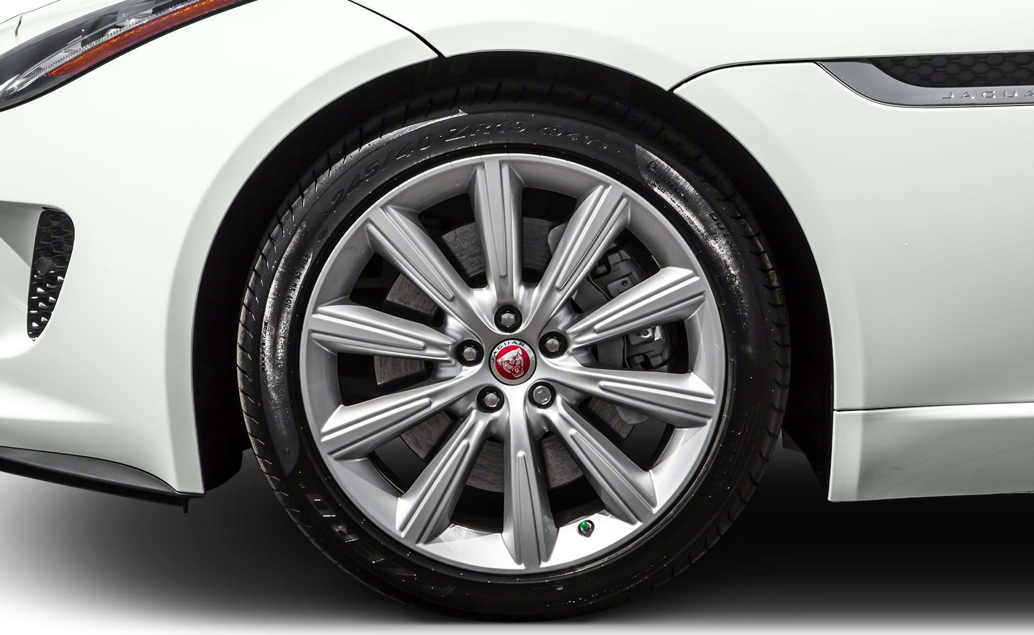 Multi-spoke alloy wheel with tire, brake caliper, and front fender vent close-up