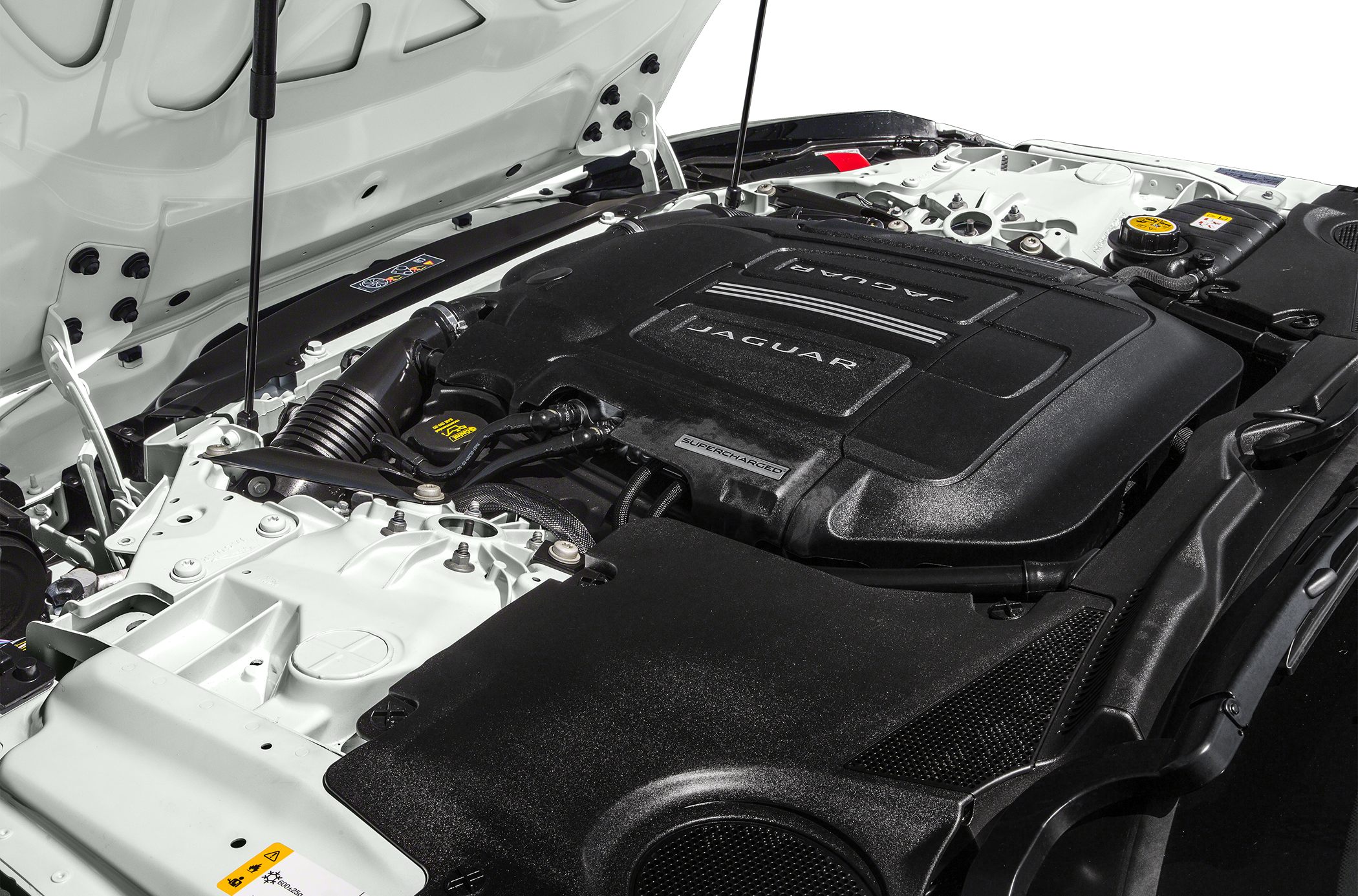 Supercharged engine bay with Jaguar branding and intake components