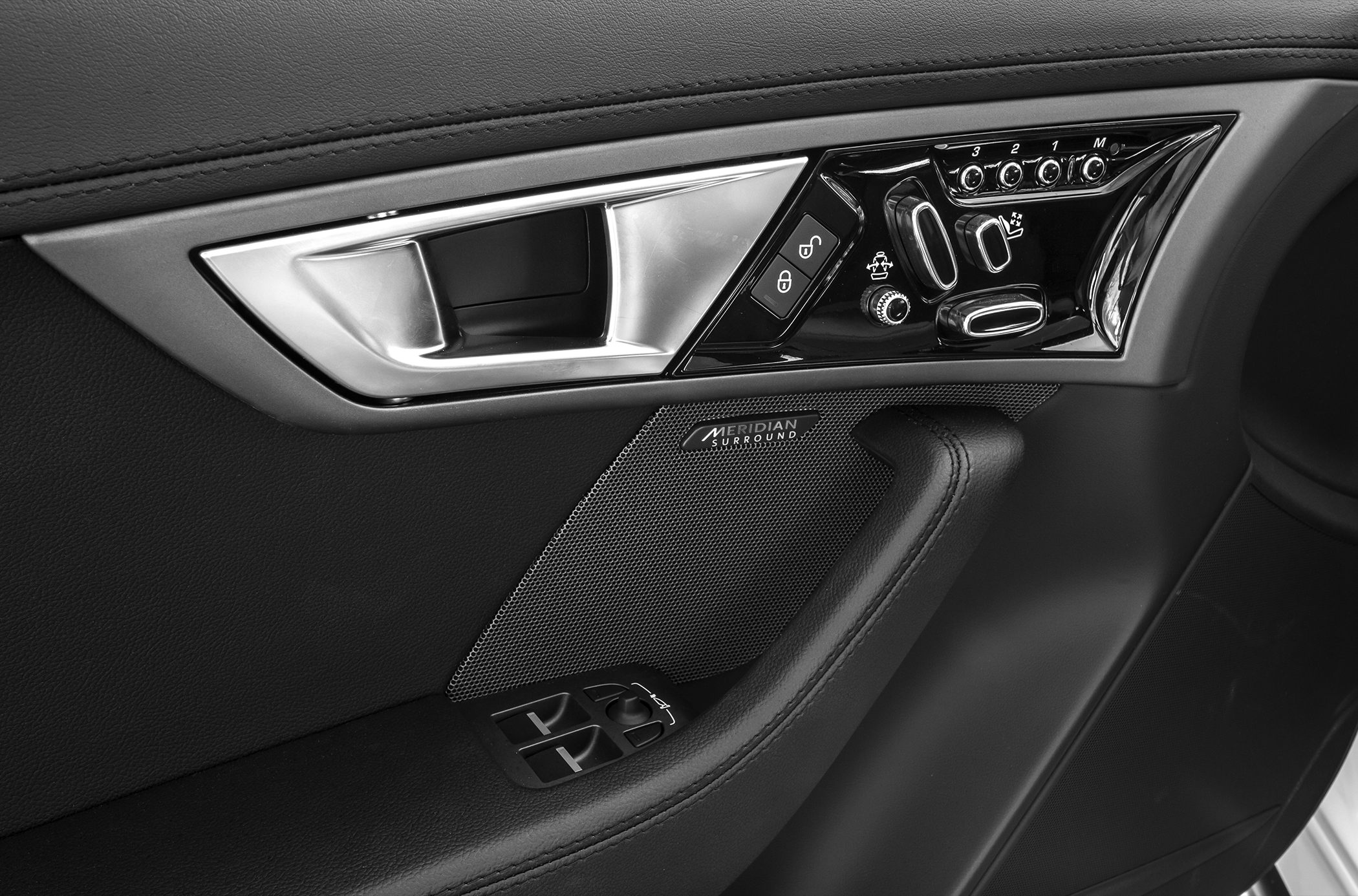 Interior door panel with controls and Meridian surround speaker