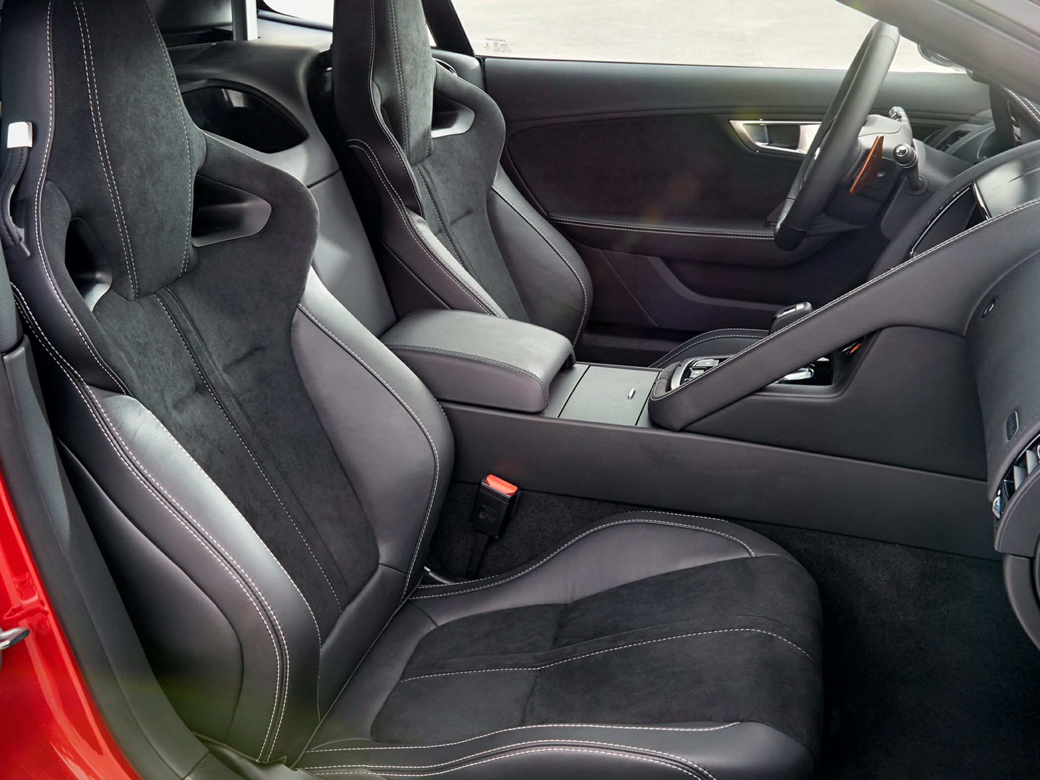 Black sports seats with white stitching in car interior