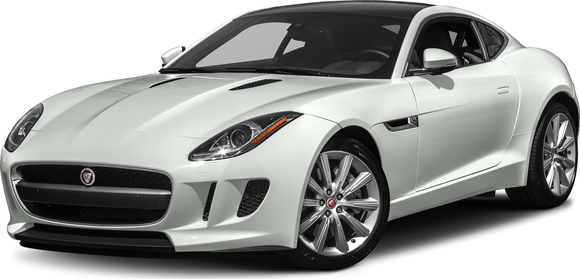 White sports coupe with focus on front grille, headlights, and alloy wheels