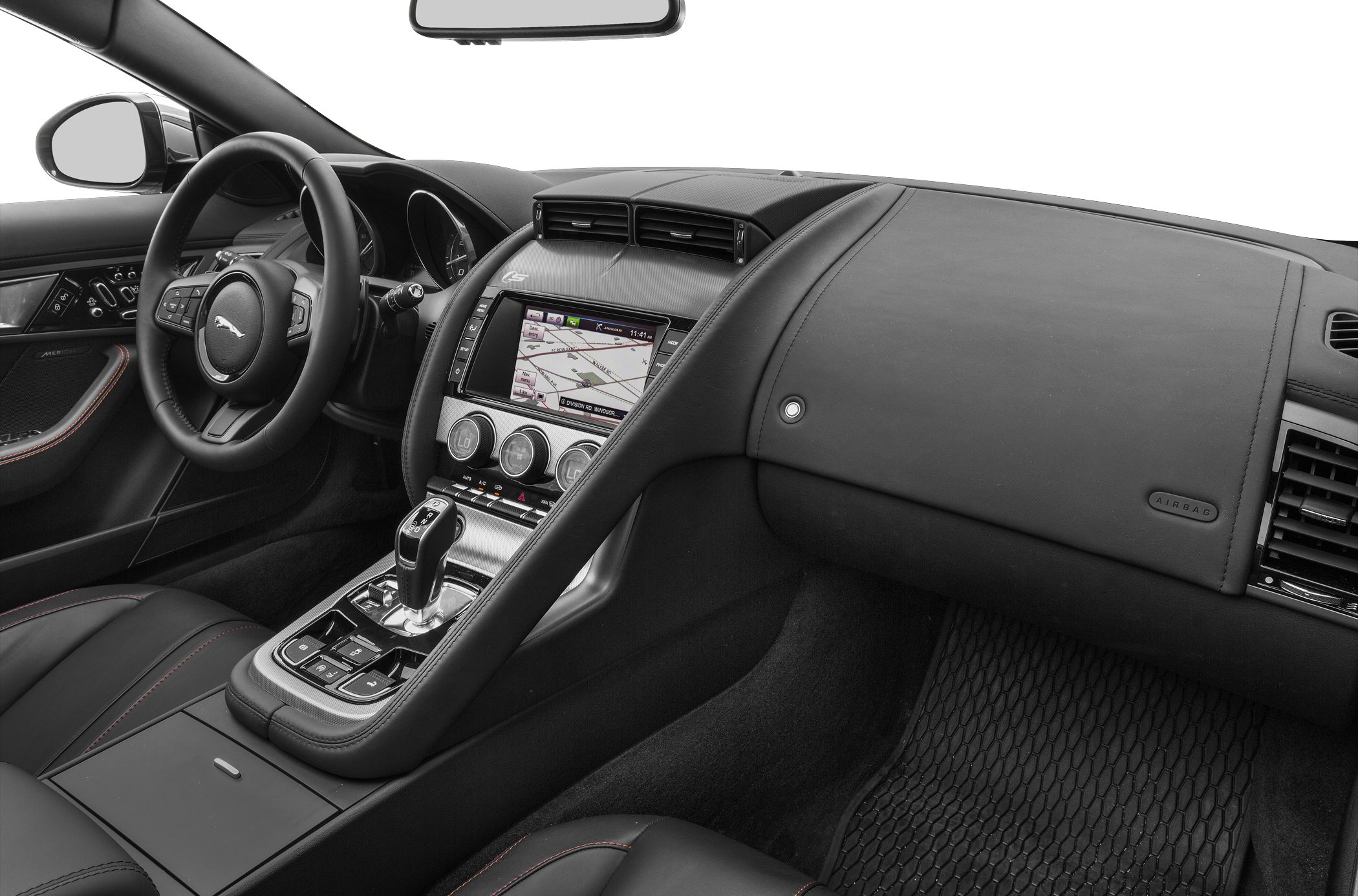 Dashboard, steering wheel, and infotainment system in luxury convertible interior
