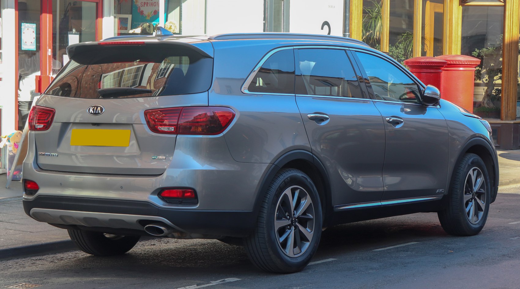 Rear view of midsize SUV with distinctive tail lights and alloy wheels