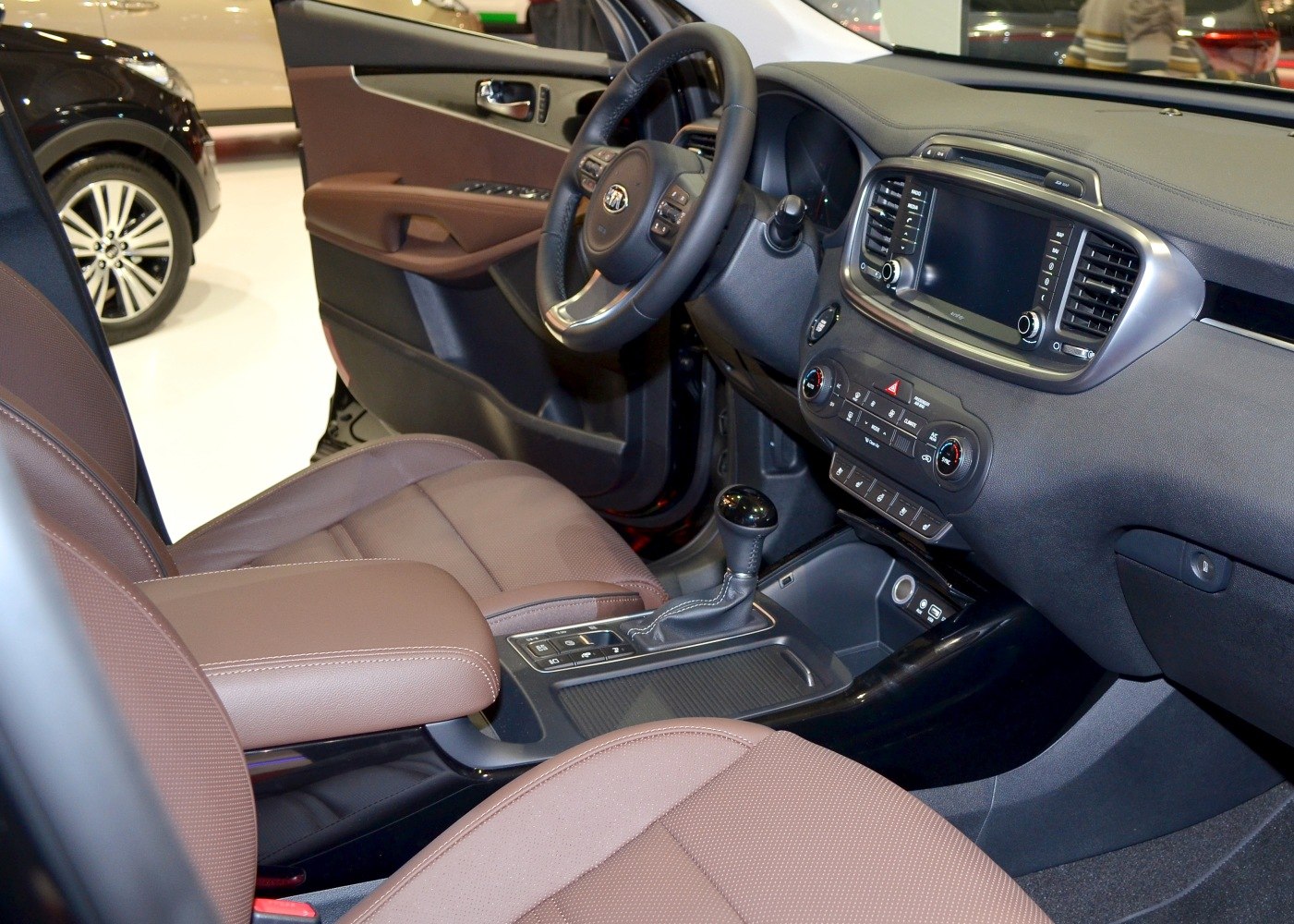 Interior dashboard, steering wheel, and gear shifter of a vehicle