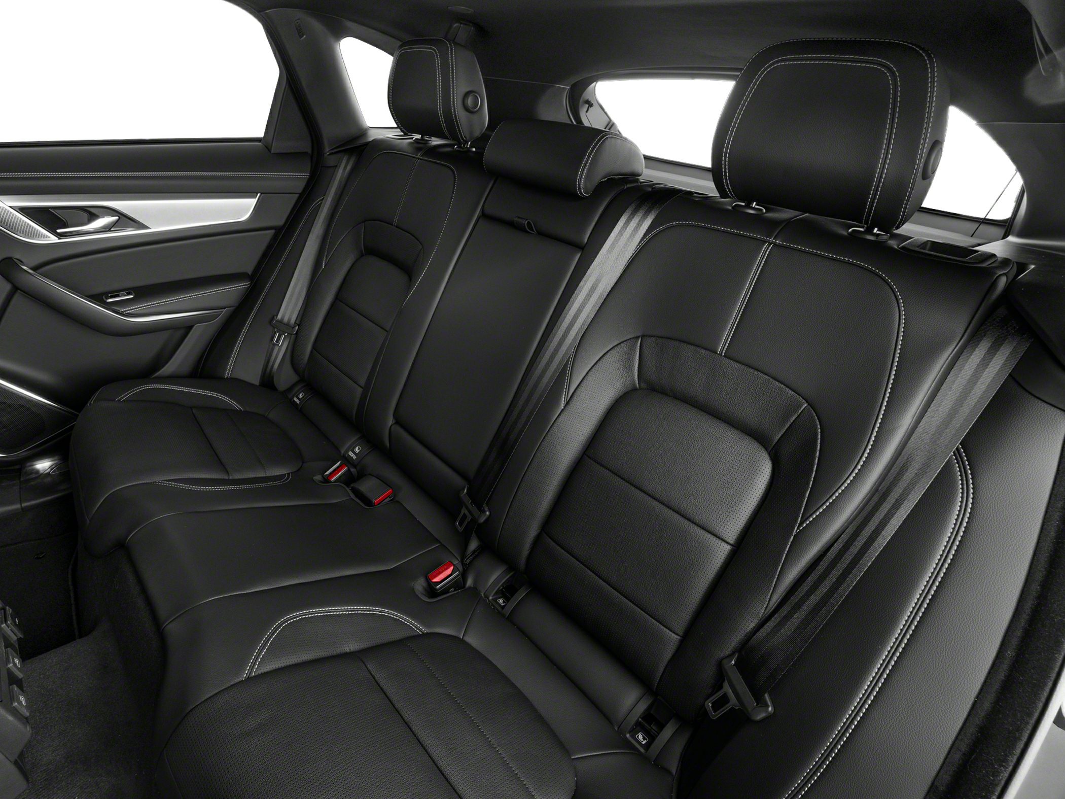 Black leather rear seats with white stitching and seat belts