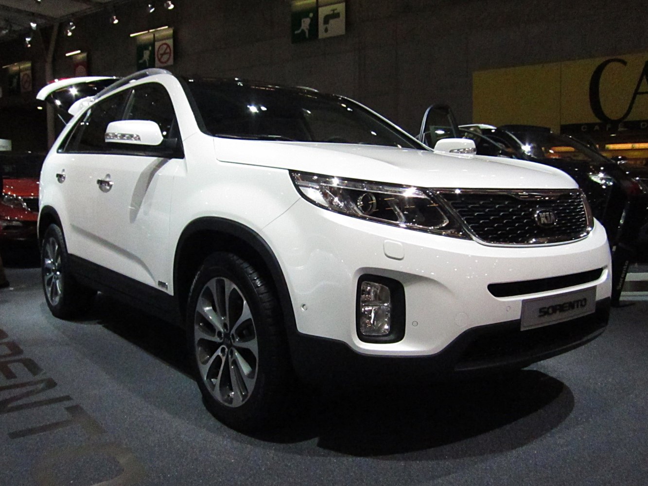 White SUV front view with LED headlights and prominent grille