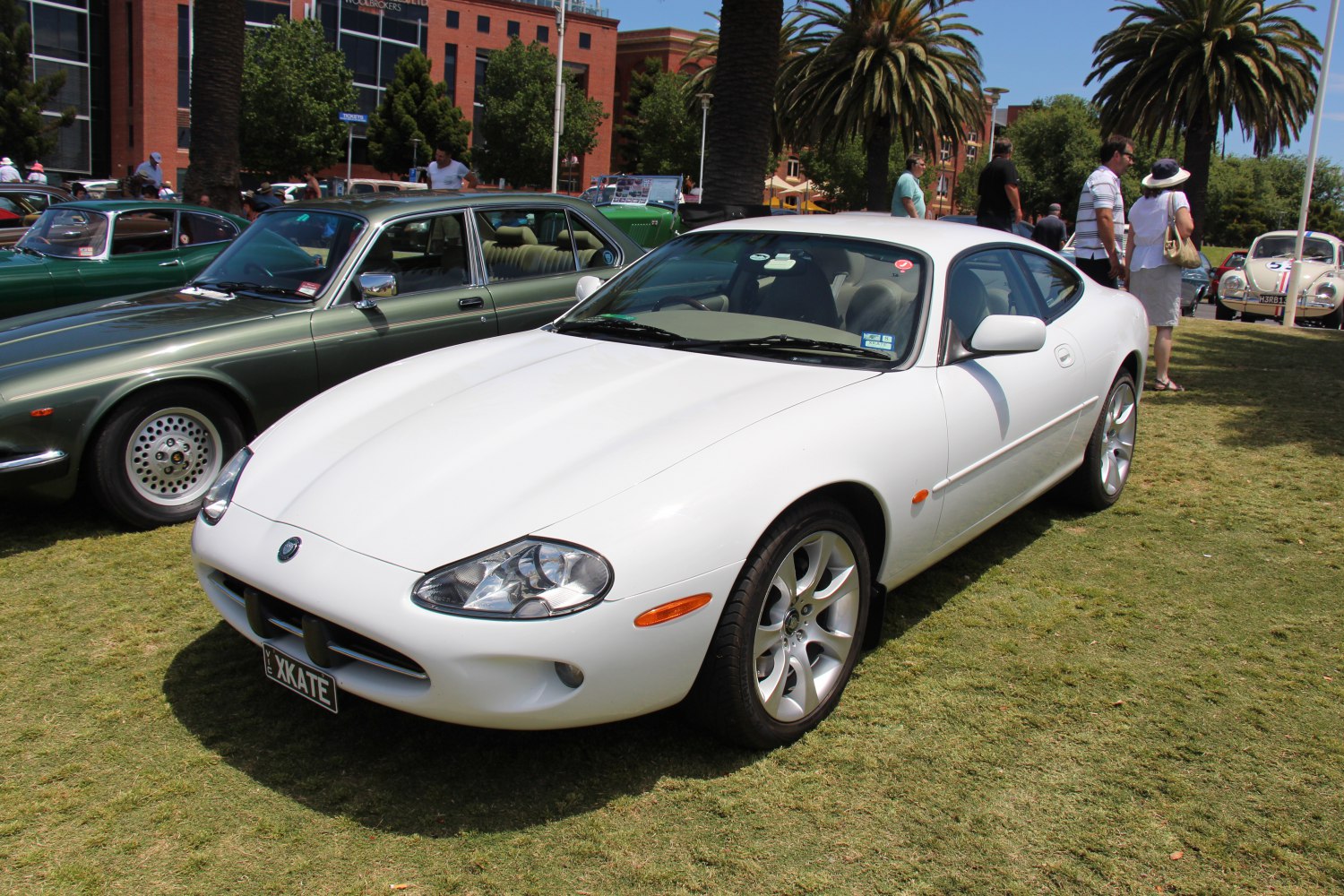 White sports coupe with sleek design and distinctive headlights