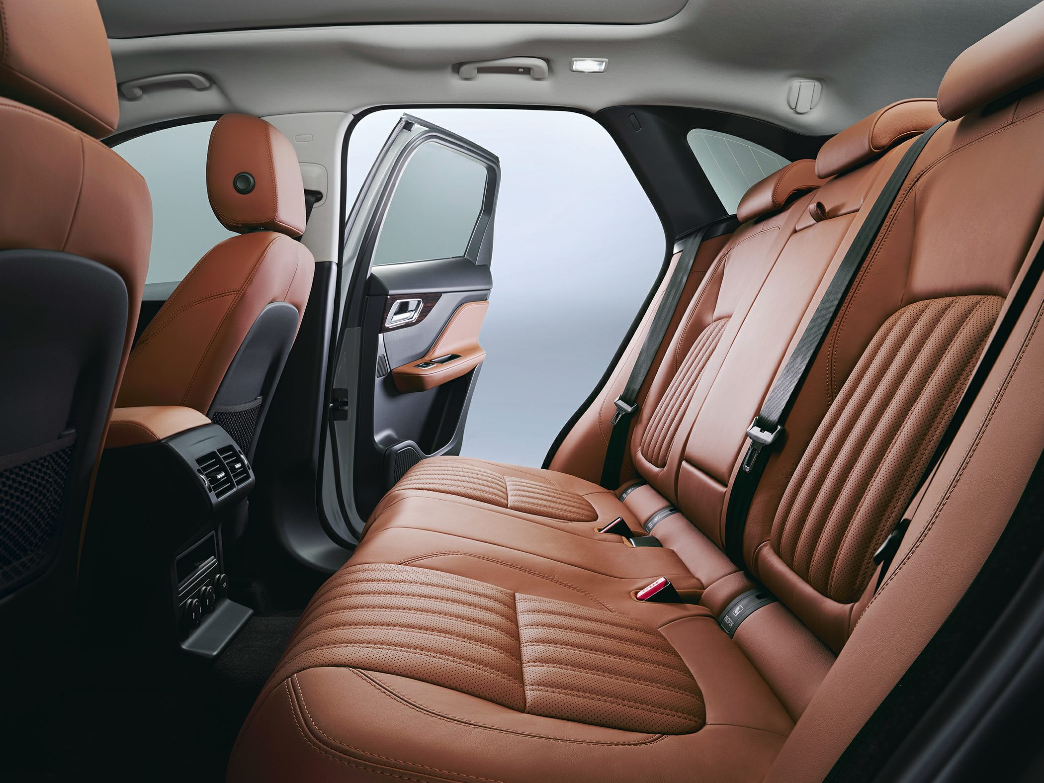 Luxury brown leather rear seats with quilted pattern and rear air vents