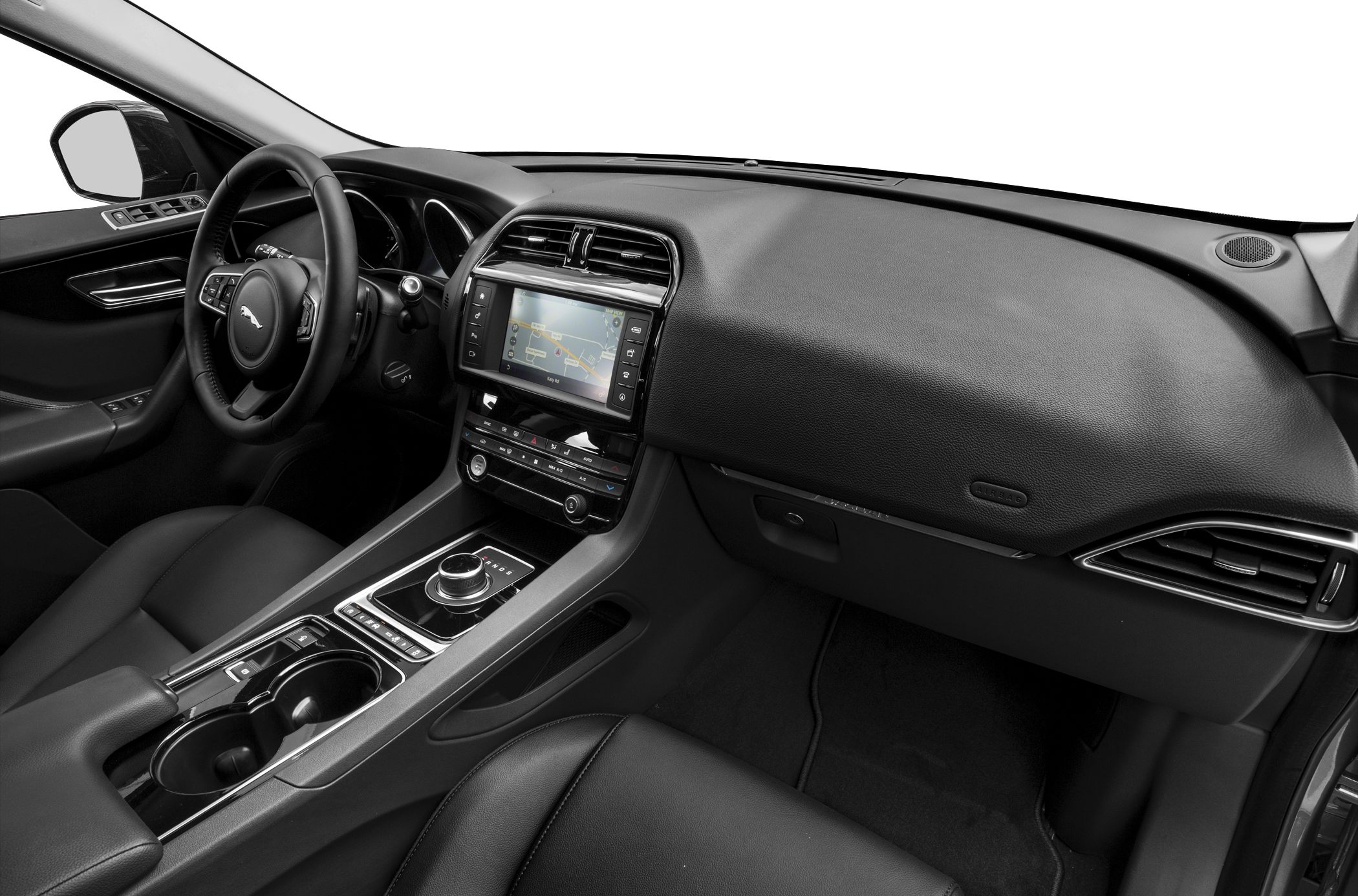 Touchscreen infotainment and rotary gear selector in a luxury SUV interior