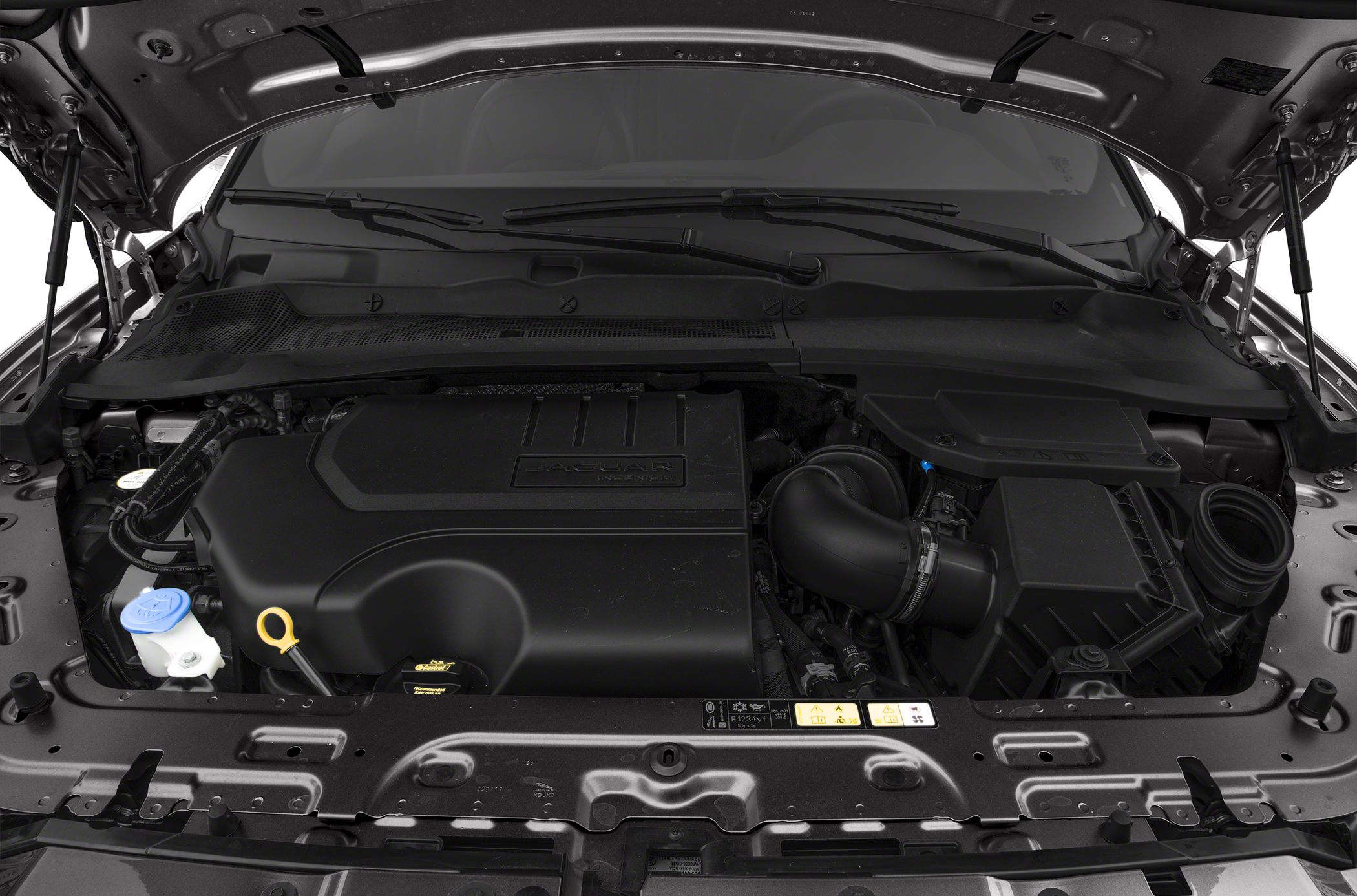 Engine bay with cover and components under open hood