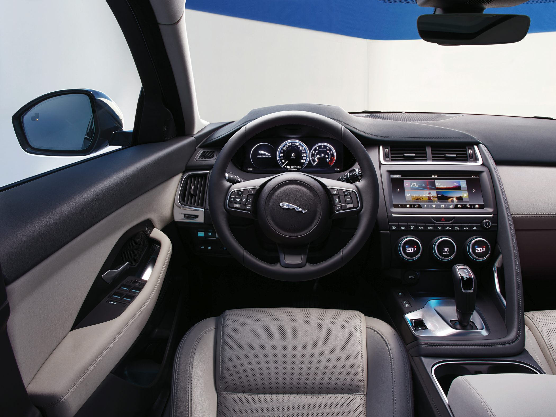 Digital instrument cluster and touchscreen infotainment system with leather steering wheel