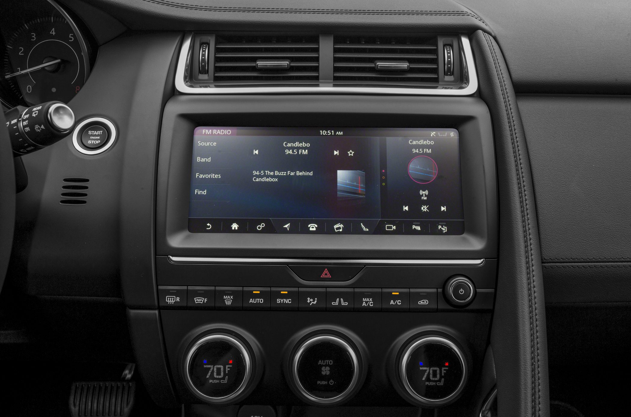 Touchscreen infotainment and climate control panel with circular temperature knobs