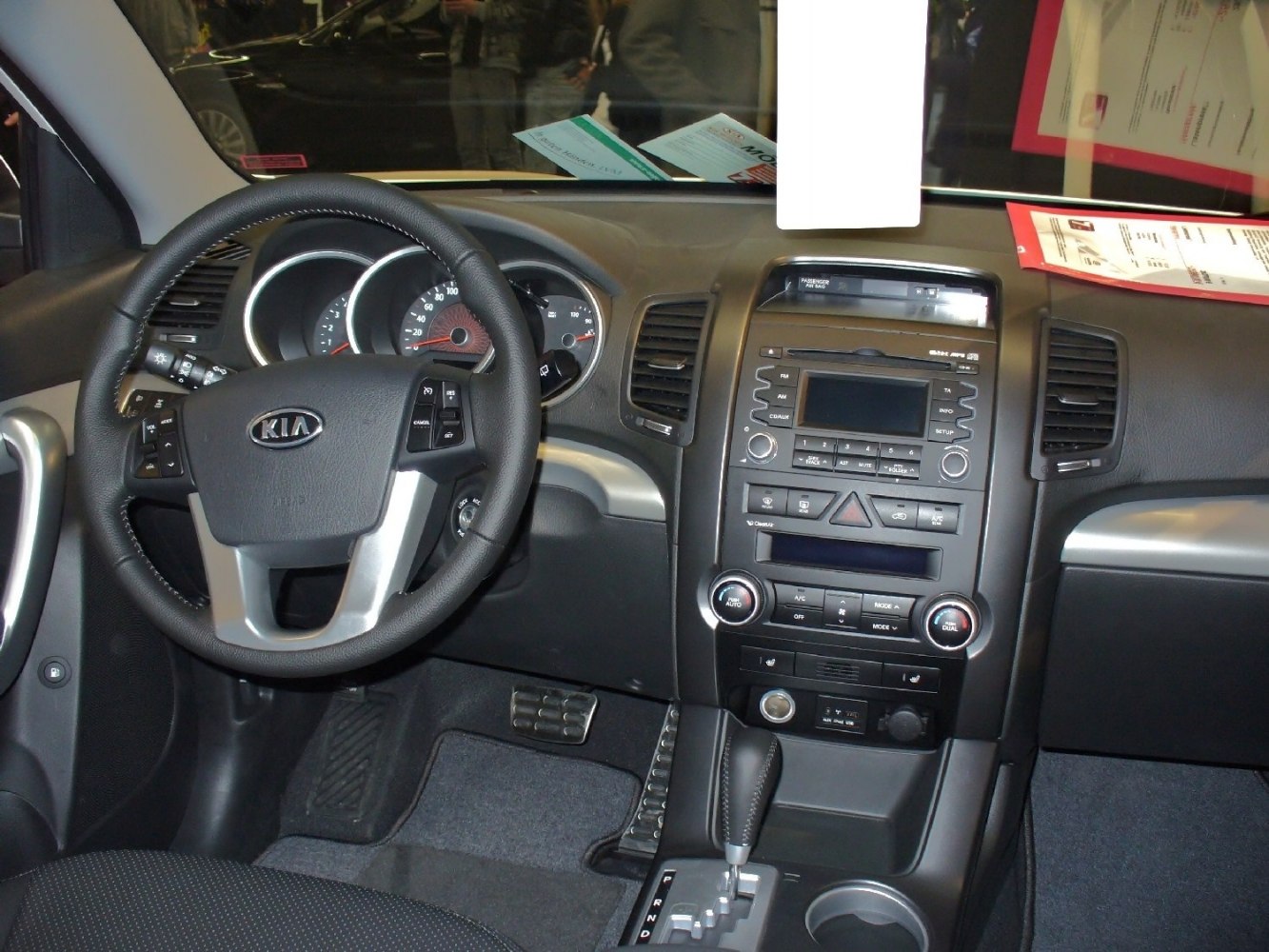 Steering wheel and dashboard center console with controls