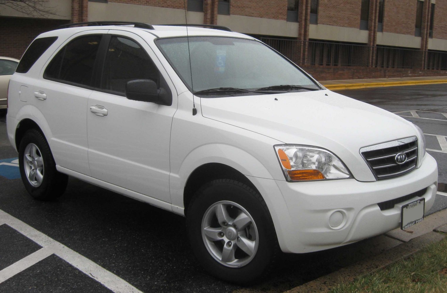 White SUV front side profile with distinct headlamps and grille