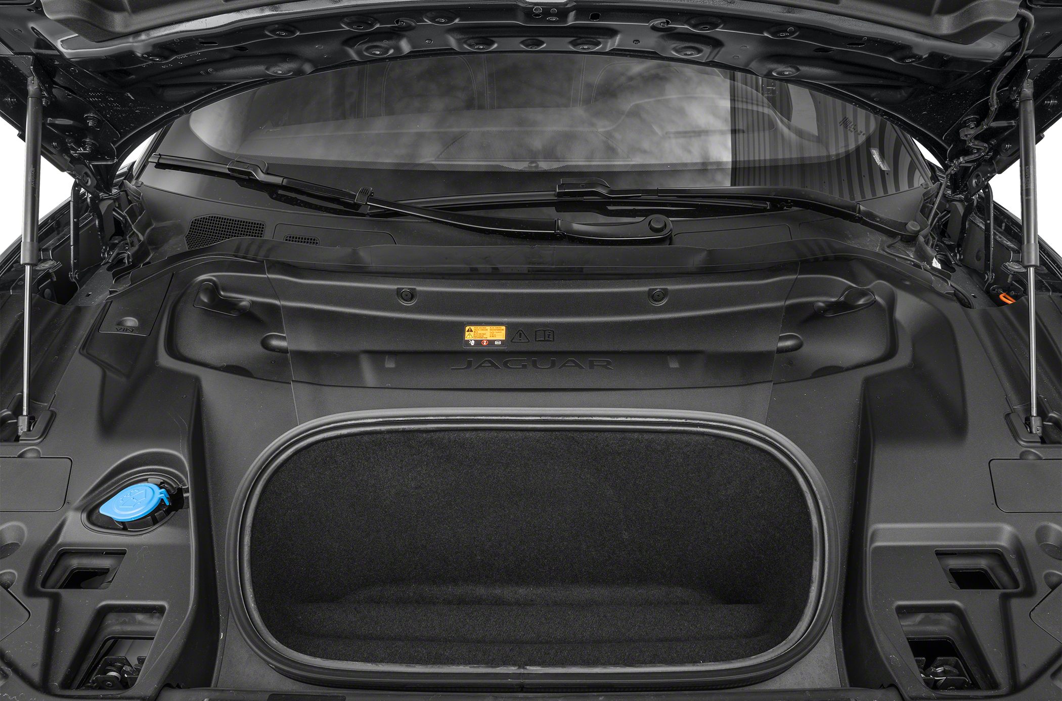 Wide front trunk (frunk) with molded plastic surrounds and windshield wiper view