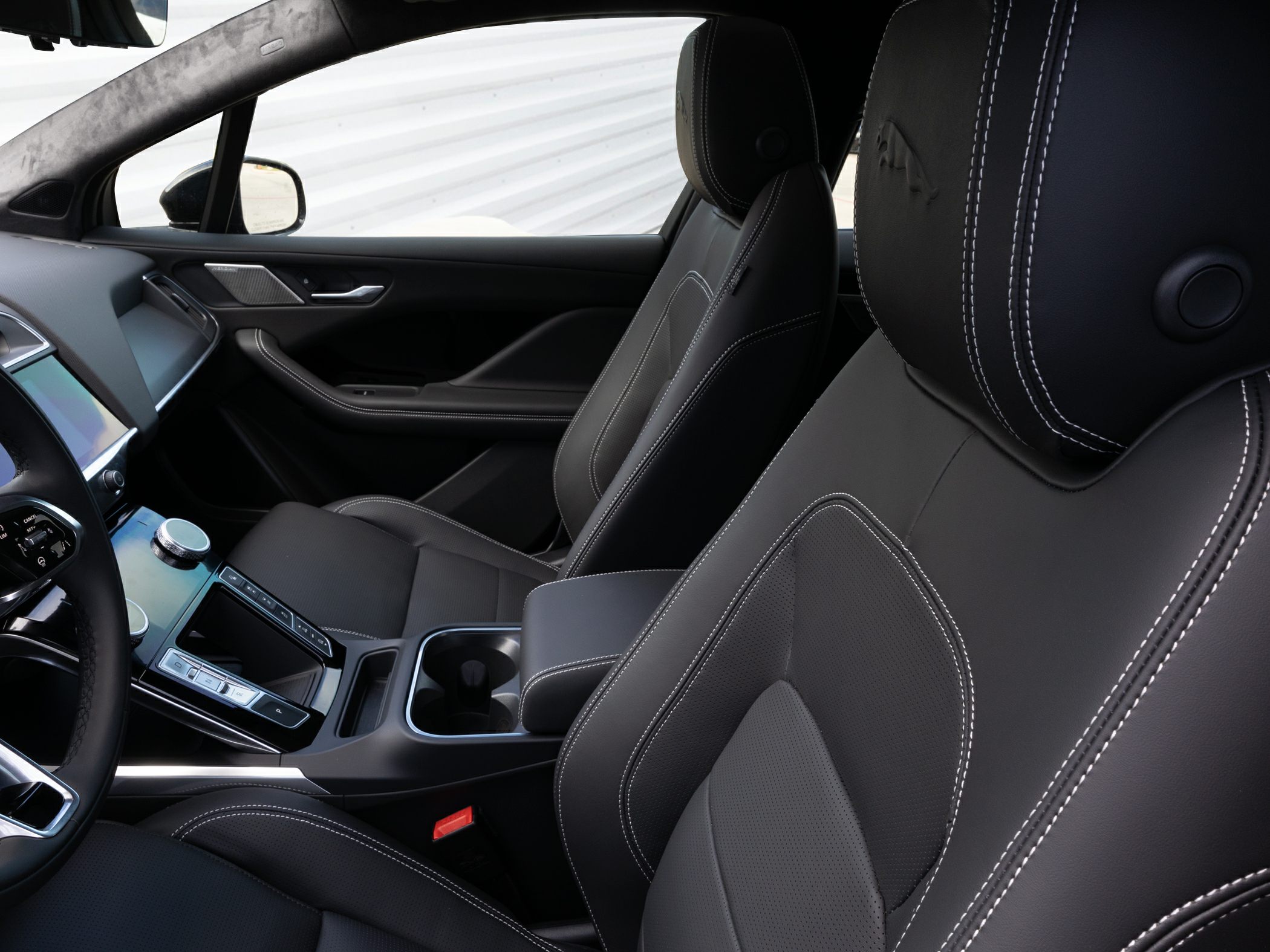 Black leather seats with detailed stitching and center console