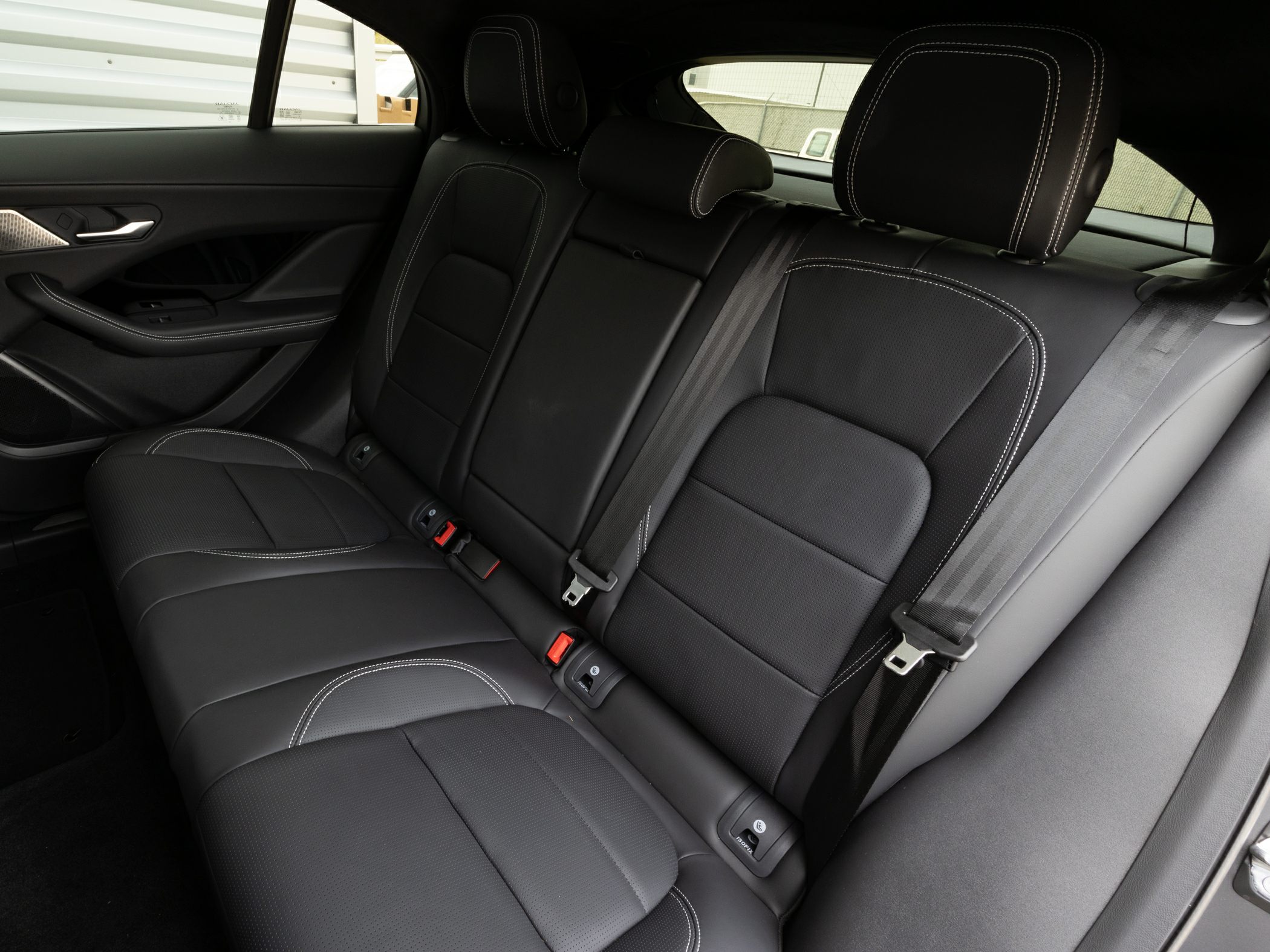 Black leather rear seats with contrast stitching and seat belts