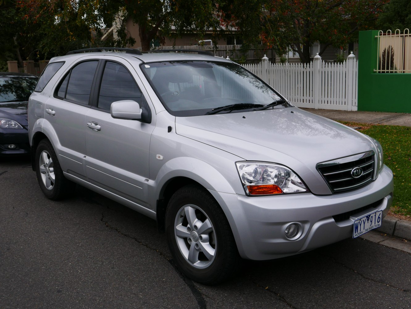 Silver SUV front side view with roof rails and alloy wheels
