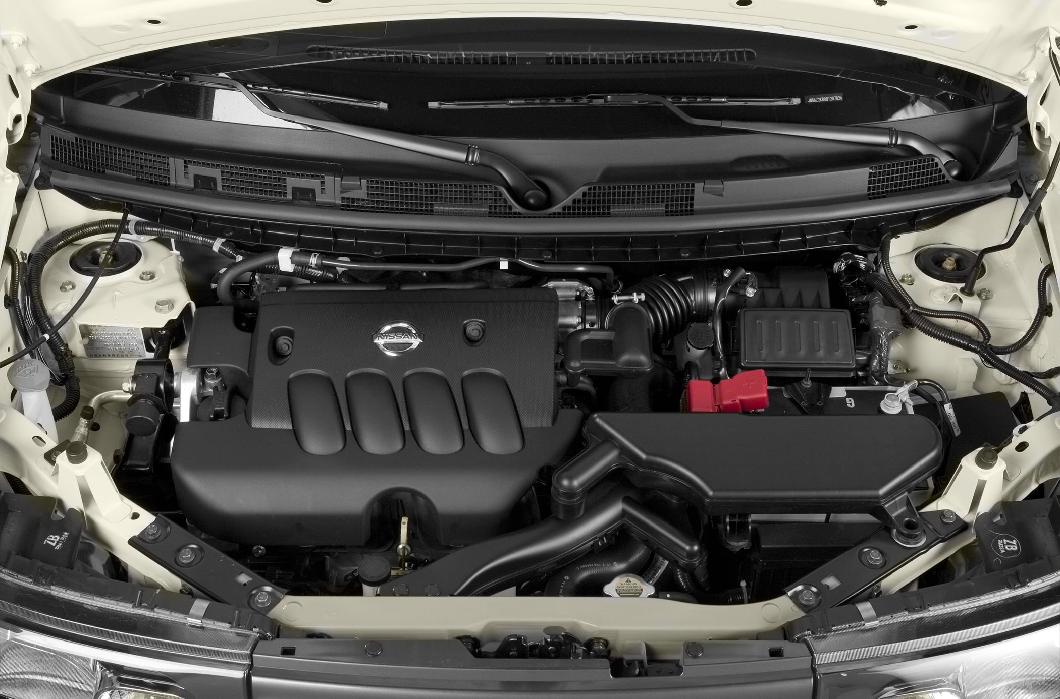 Nissan Cube Z12 engine bay with visible engine cover and components