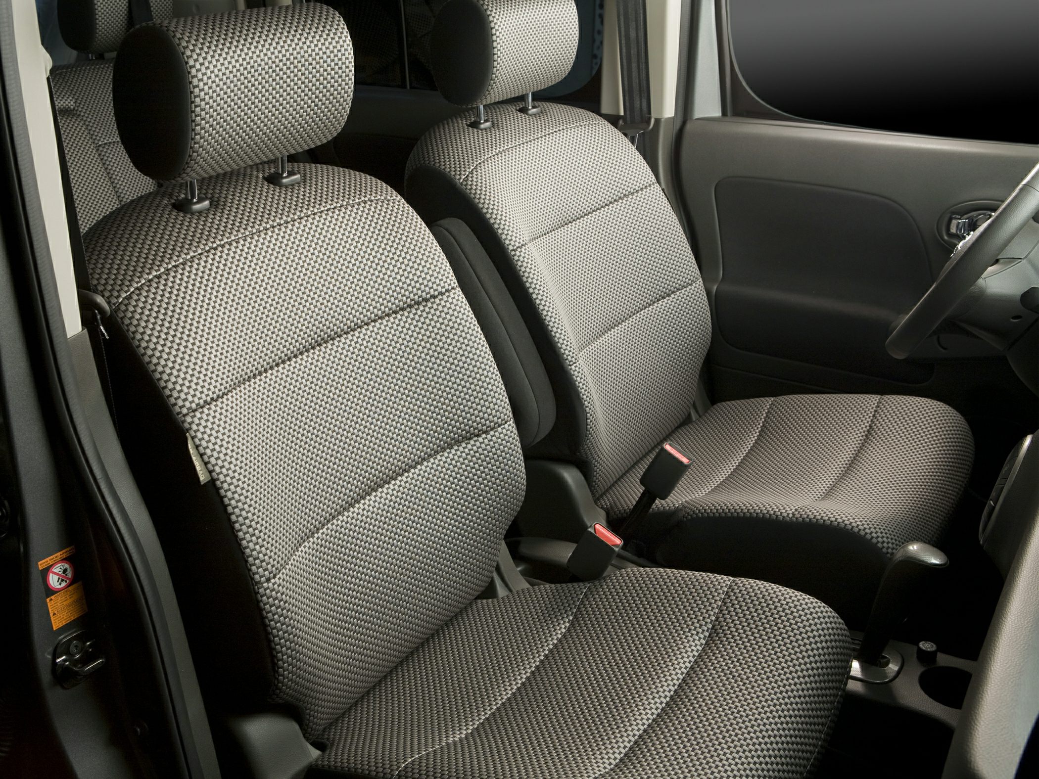 Patterned fabric front seats and practical compact car cabin interior