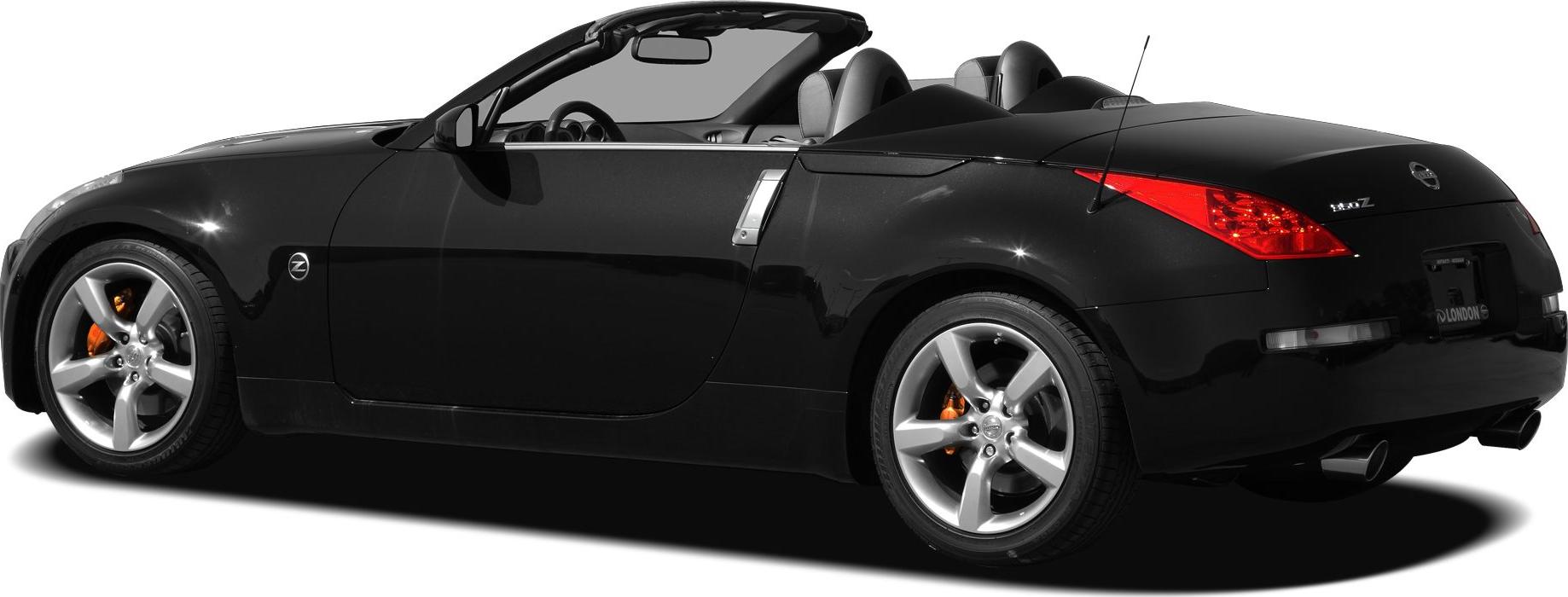 Black open-top convertible with silver alloy wheels and dual exhaust