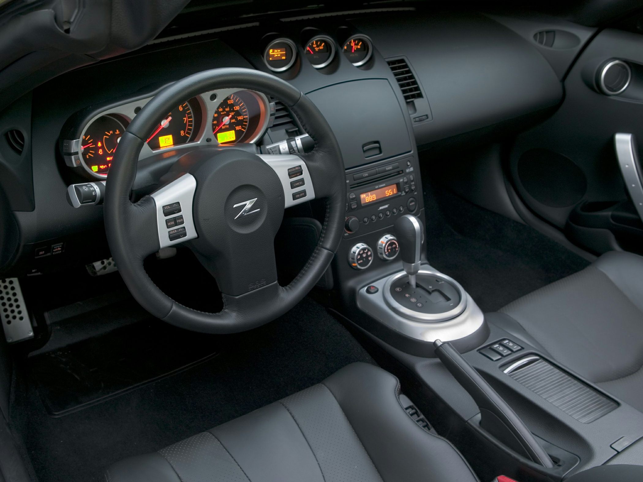 Steering wheel, dashboard gauges, and center console with gear selector