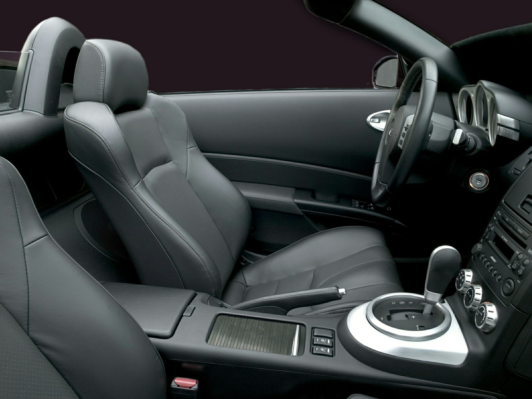 Leather seats and gearshift in a convertible sports car interior