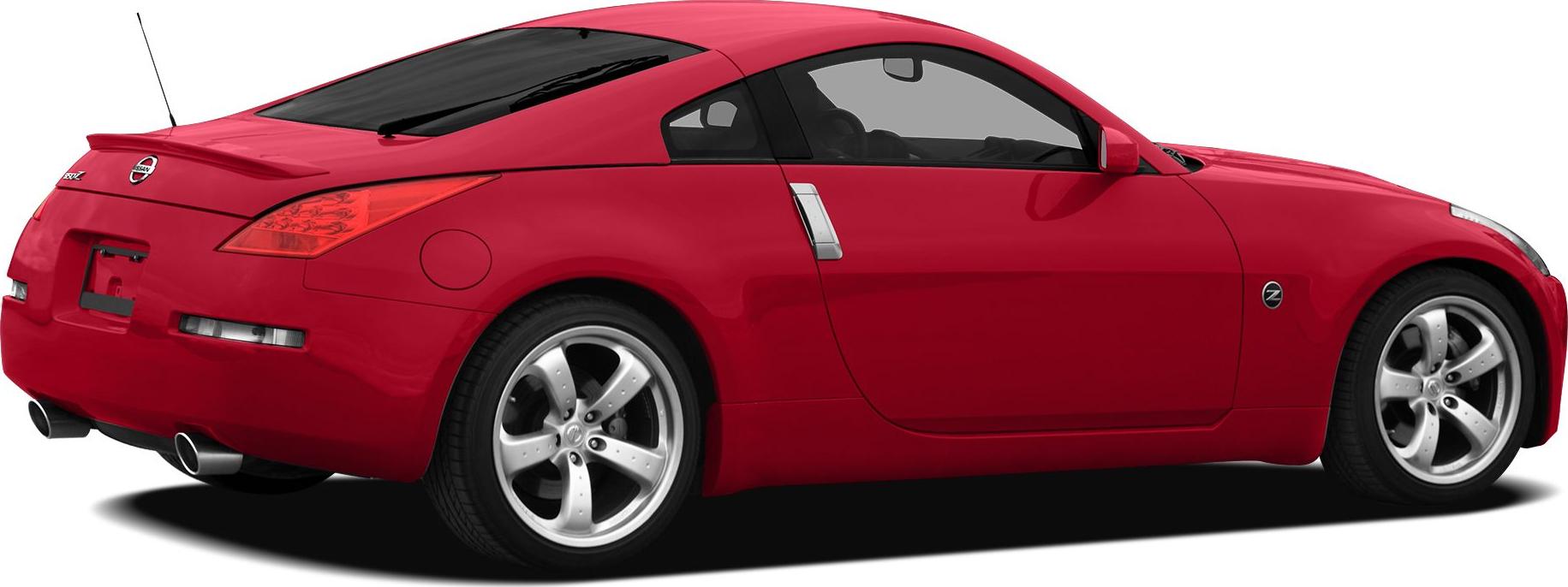 Red sports coupe side rear view with spoiler and dual exhausts