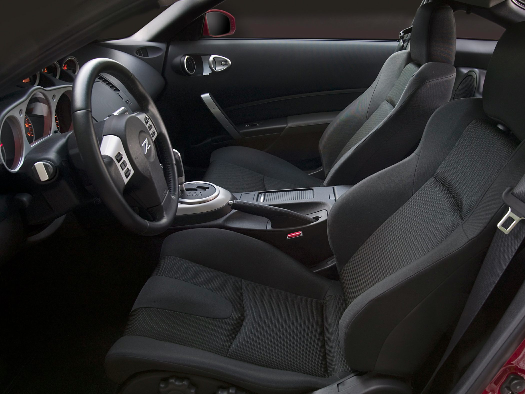 Sporty seats and modern dashboard with steering wheel and center console
