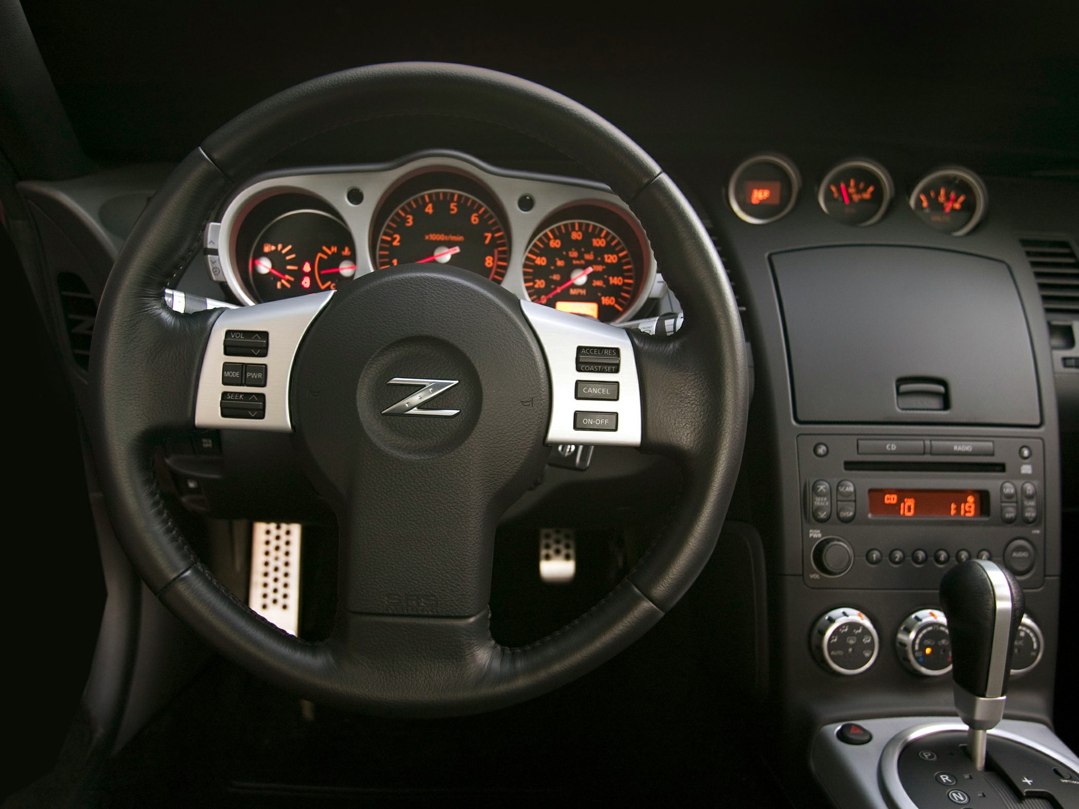 Steering wheel, instrument cluster, and center console interior view