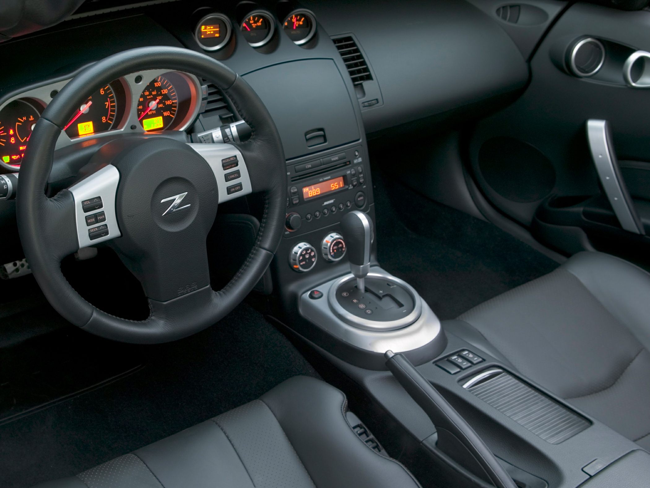 Sporty steering wheel and center console with gear shifter