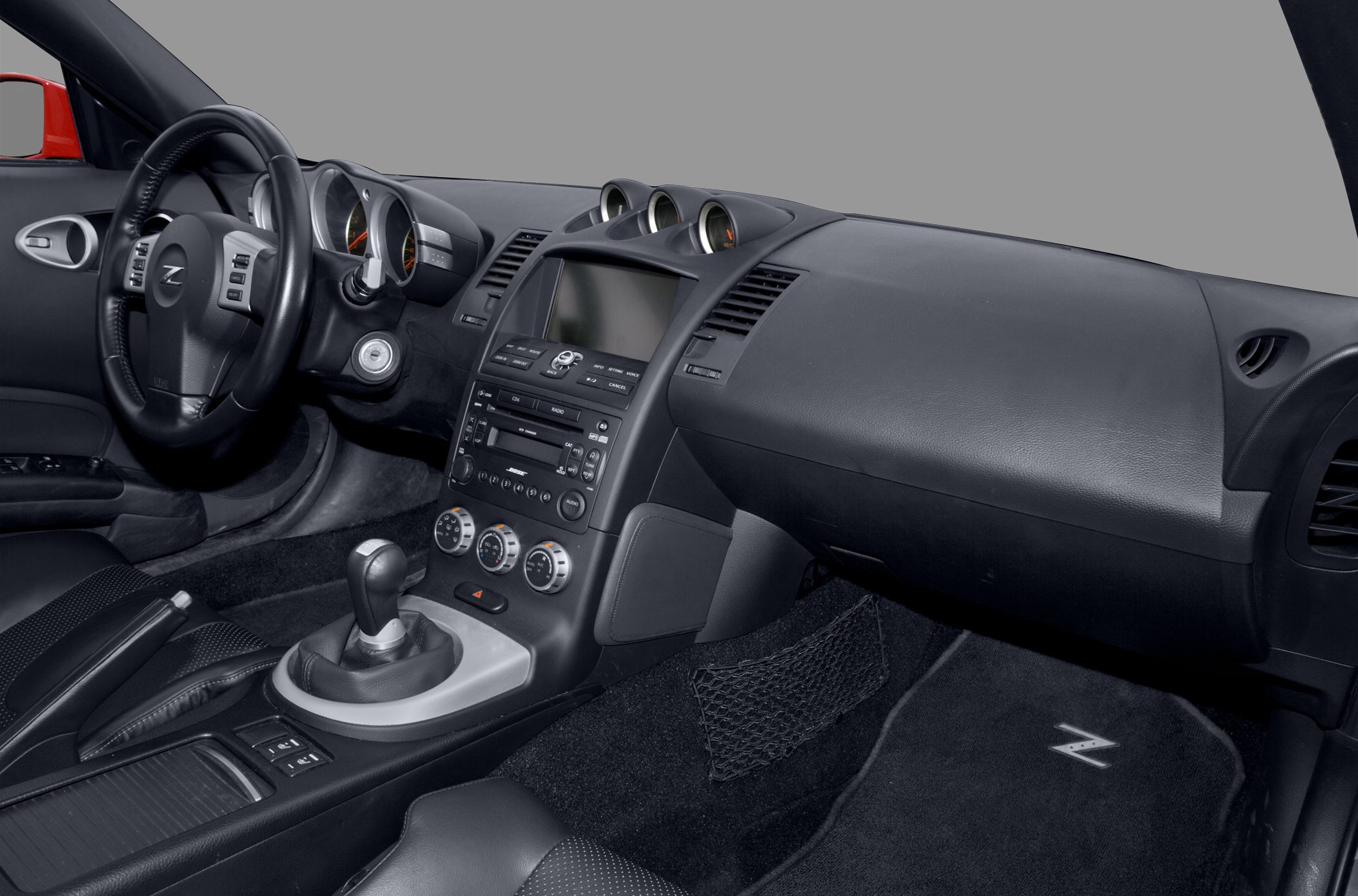 Dashboard, steering wheel, center console of a 2007 sports car interior