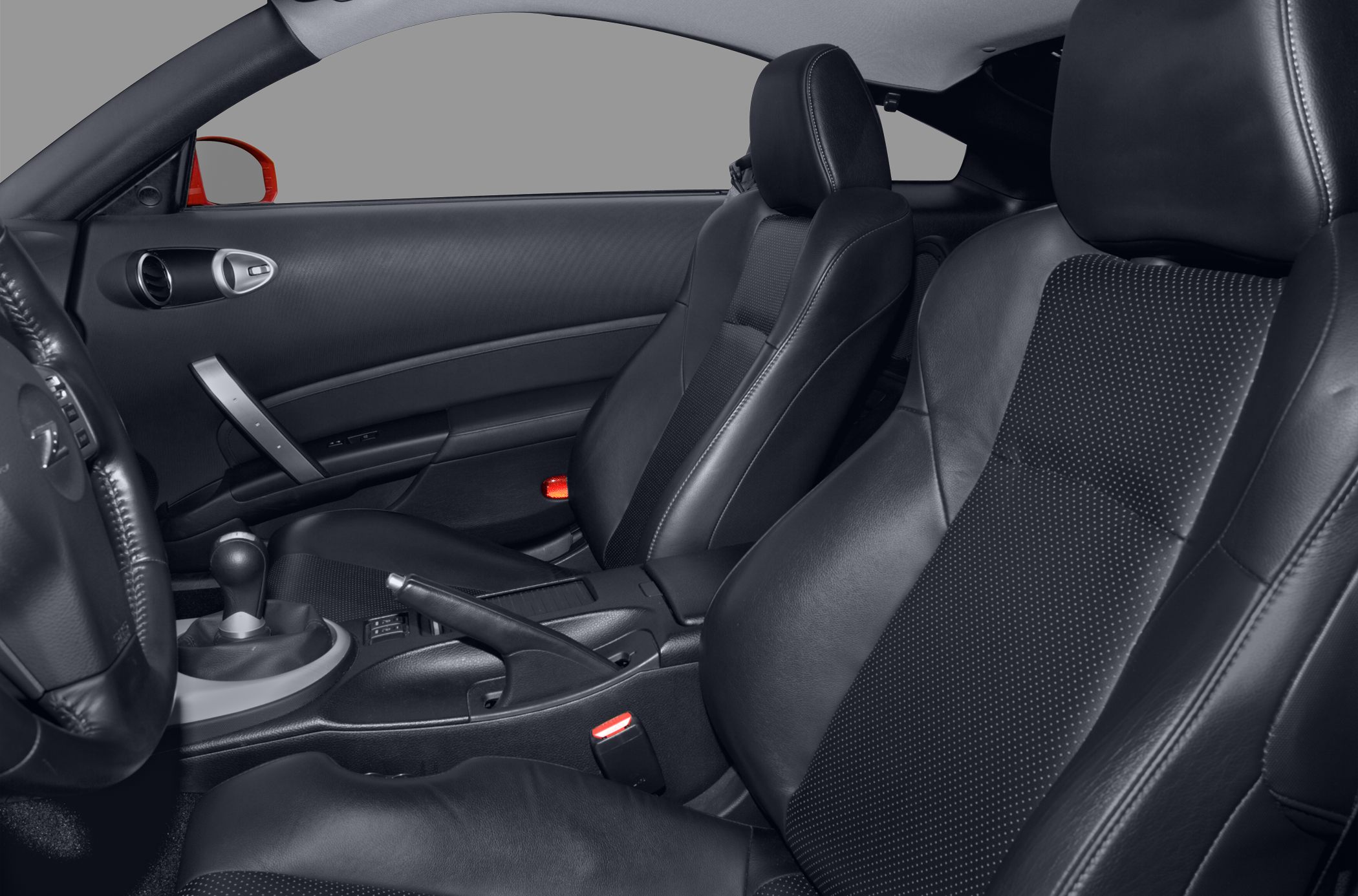 Black leather front seats and interior cabin with manual gearshift