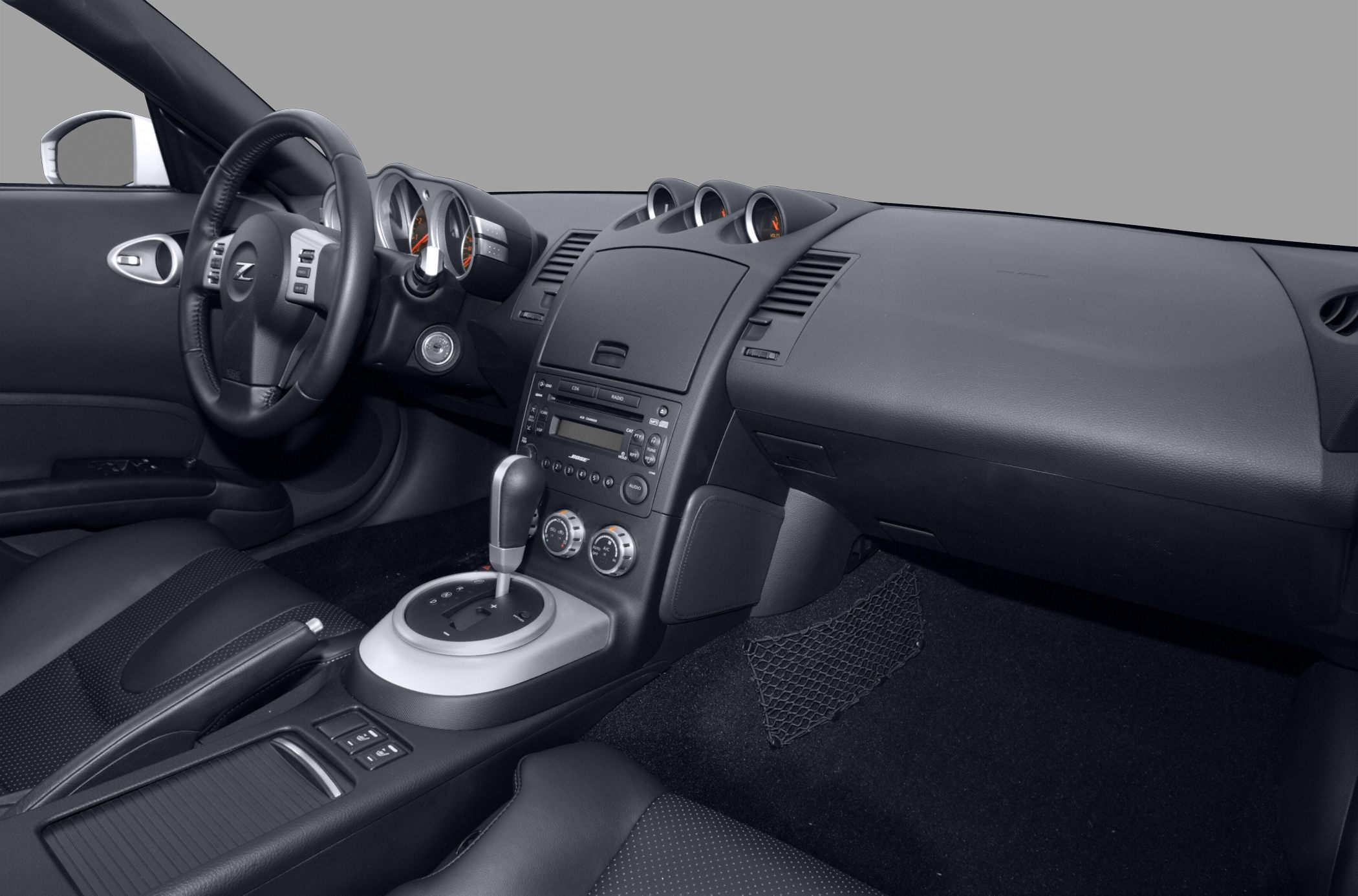 Dashboard and center console with steering wheel and gear shift