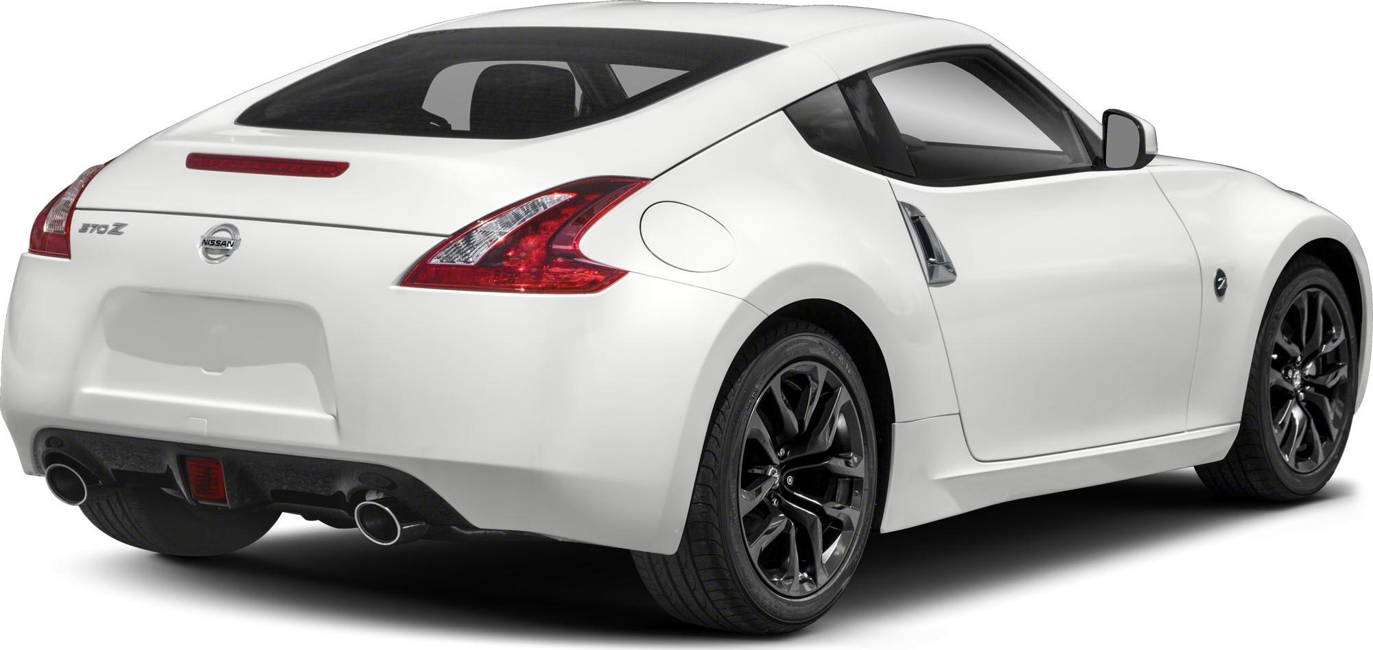 White coupe rear side with dual exhaust and black rims
