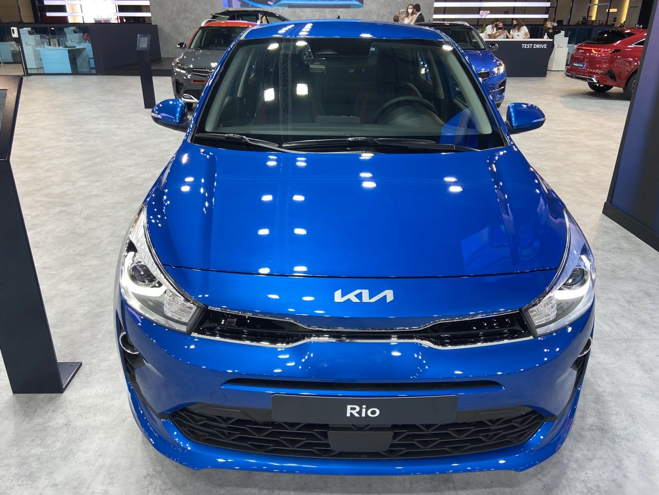 Front view with grille, headlights and hood design.
